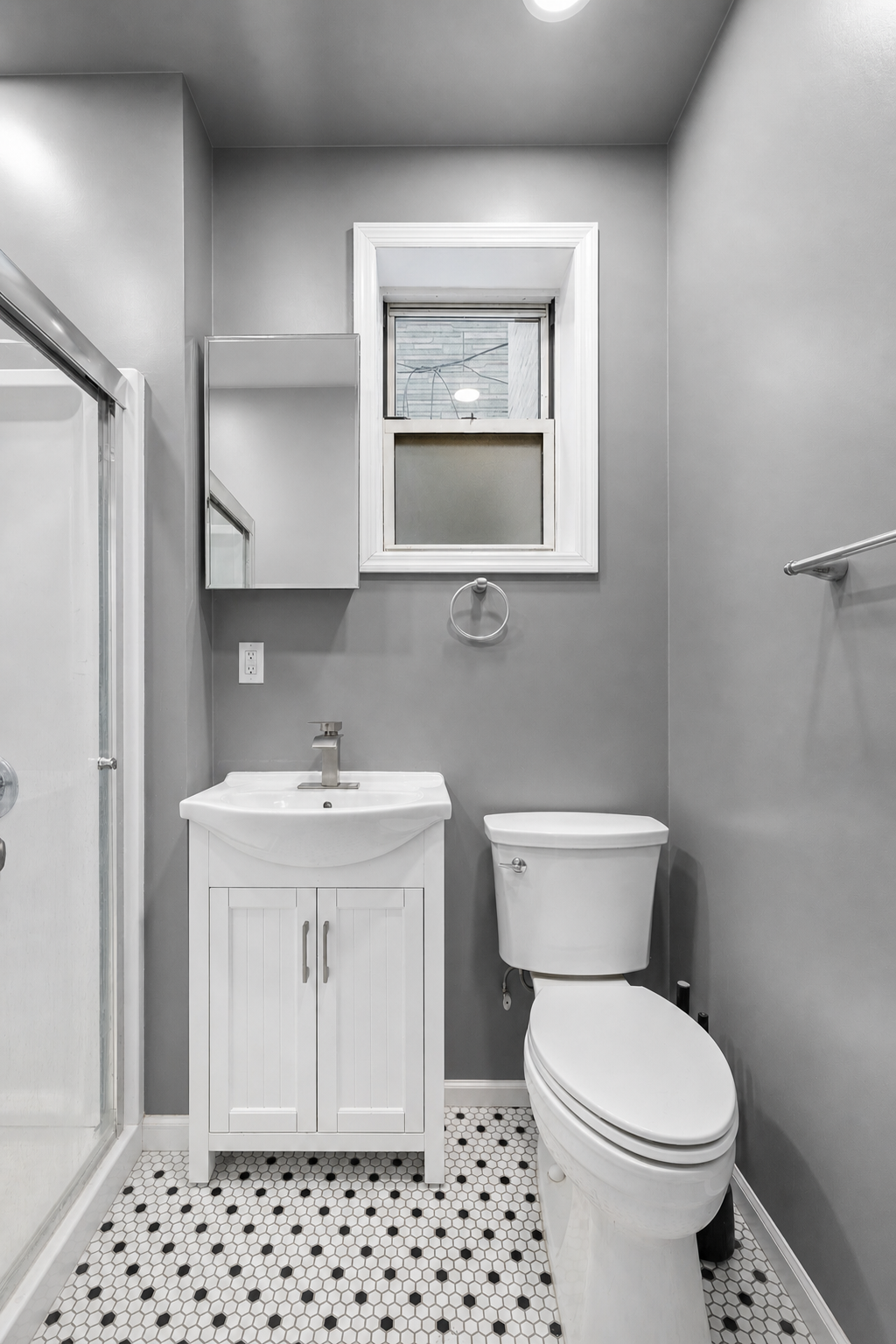 996 Hart Street, Unit 2 Brooklyn, NY 11237 - Photo 5 of 7 a bathroom with a sink a toilet and mirror