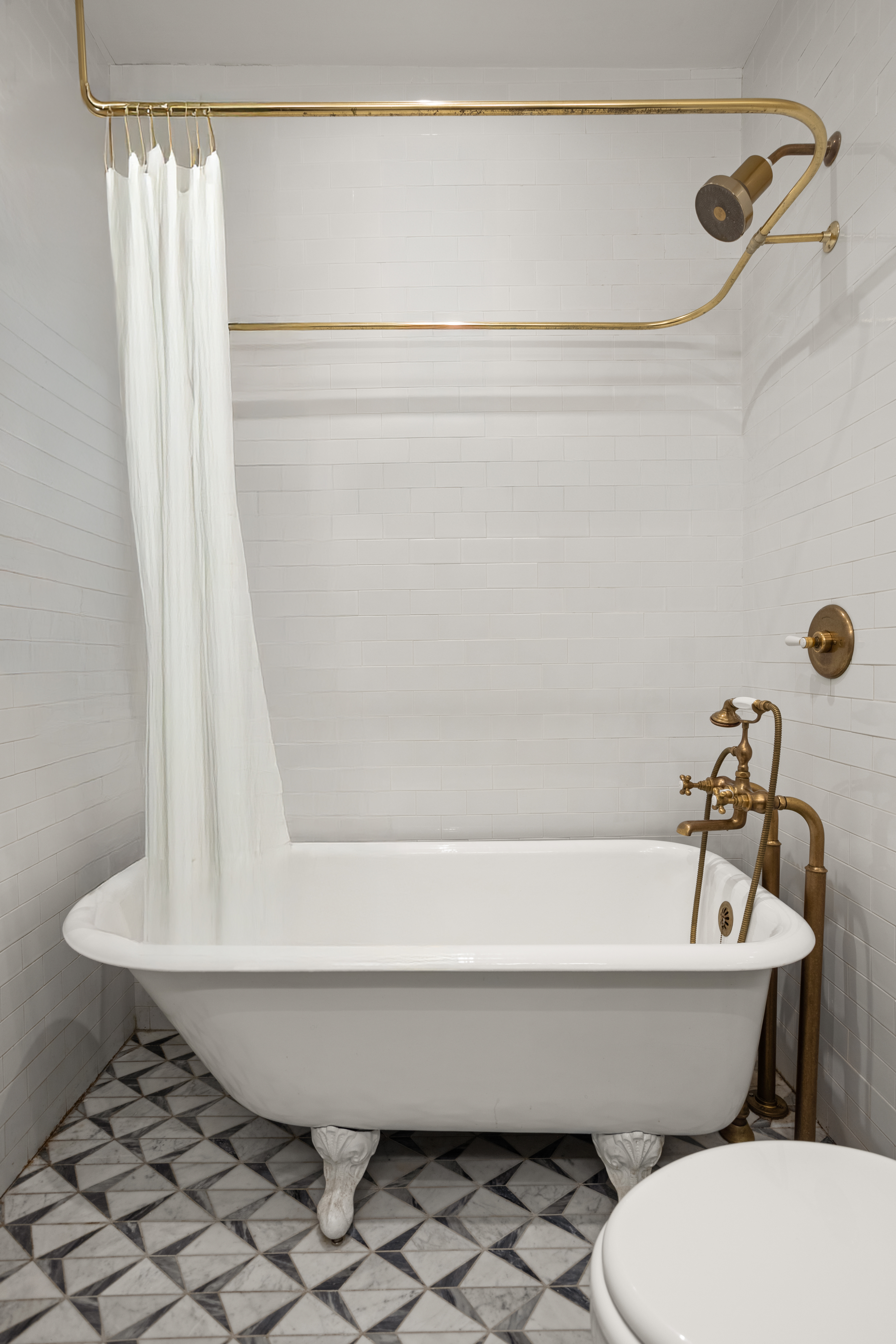 537 East 6th Street, Unit 5 Manhattan, NY 10009 - Photo 11 of 12 a bathroom with a sink and a bathtub