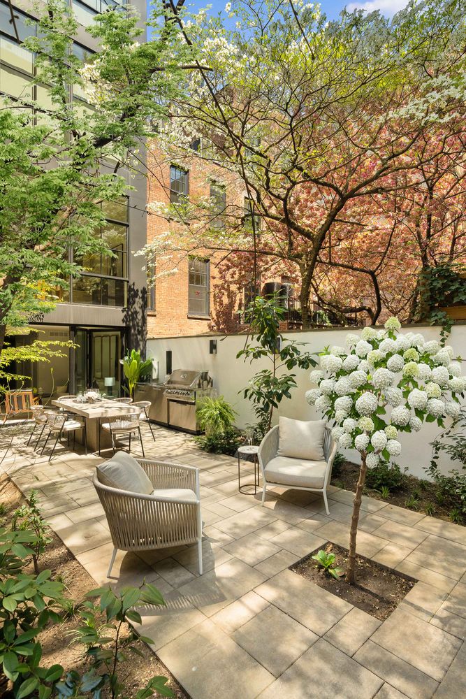 520 East 89th Street Manhattan, NY 10128 - Photo 21 of 40 a swimming pool with outdoor seating and plants