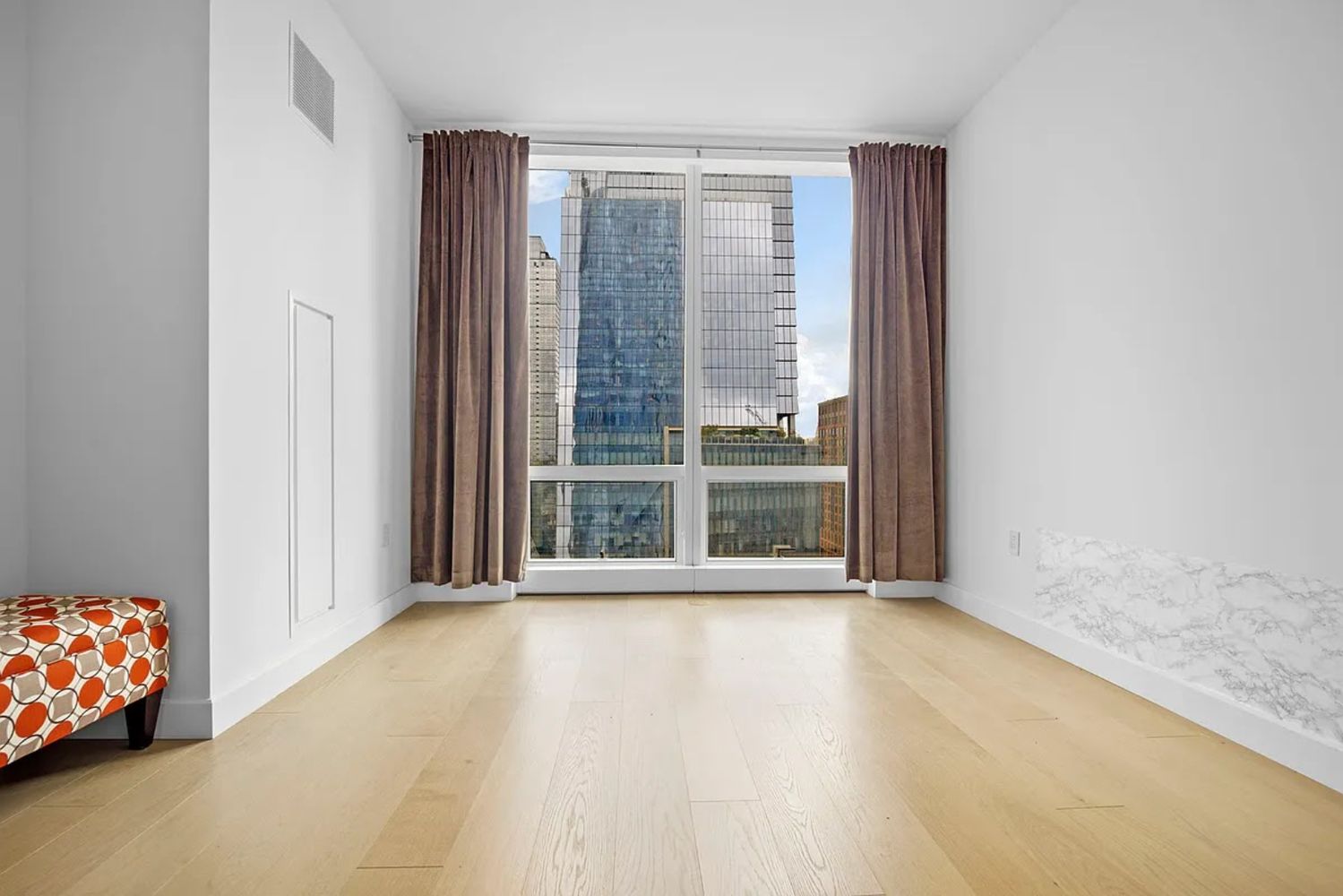 15 Hudson Yards, Unit 28J Manhattan, NY 10001 - Photo 3 of 5 a view of an empty room with wooden floor and a window
