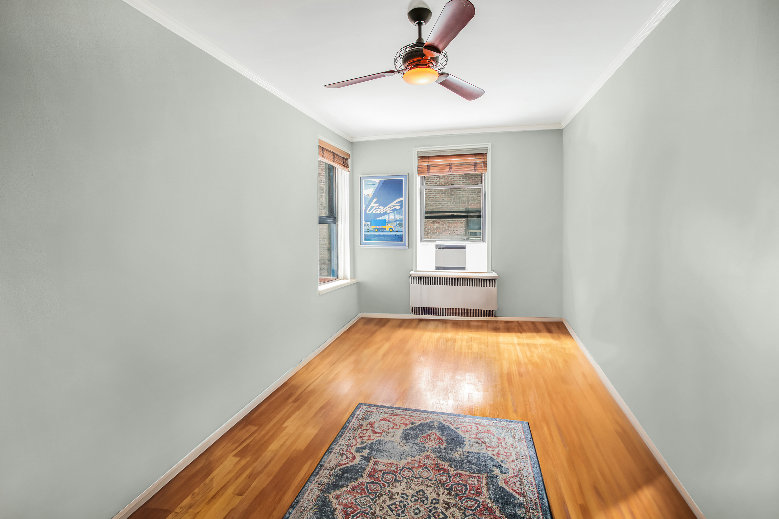 657 East 26th Street, Unit 3G Brooklyn, NY 11210 - Photo 11 of 14 wooden floor in an empty room with a window