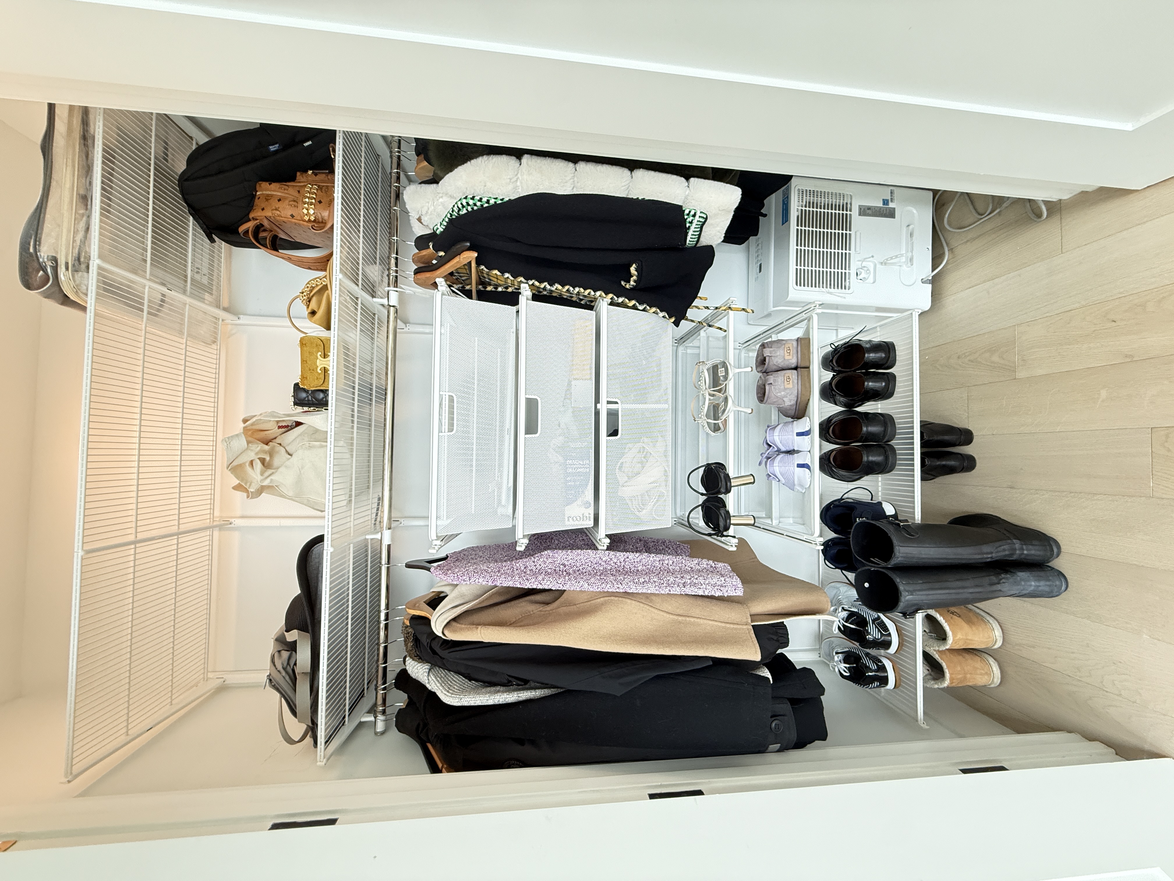 4507 Court Square, Unit 8D Queens, NY 11101 - Photo 13 of 28 a view of walk in closet with clothes and shoes