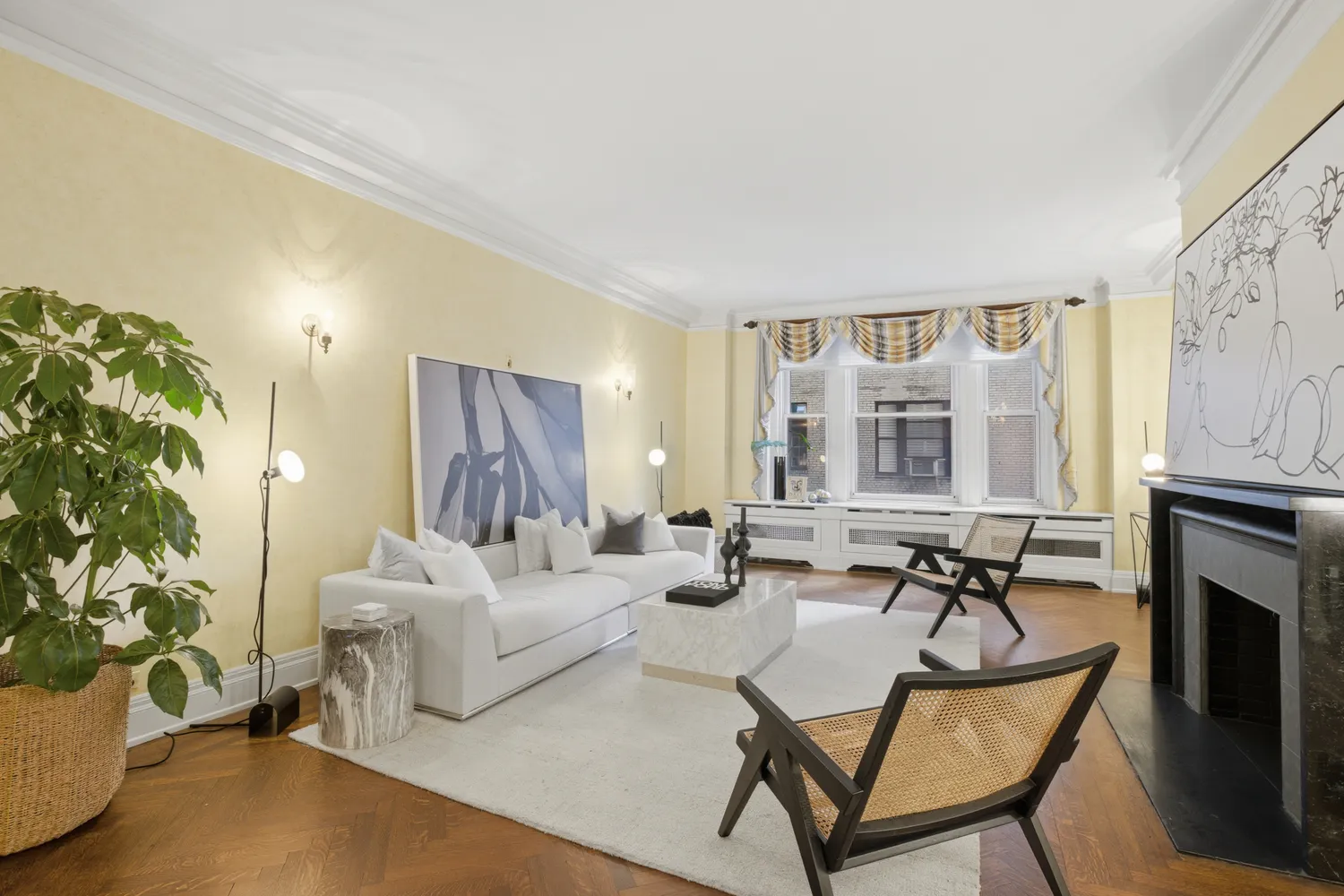 a living room with furniture and a fireplace