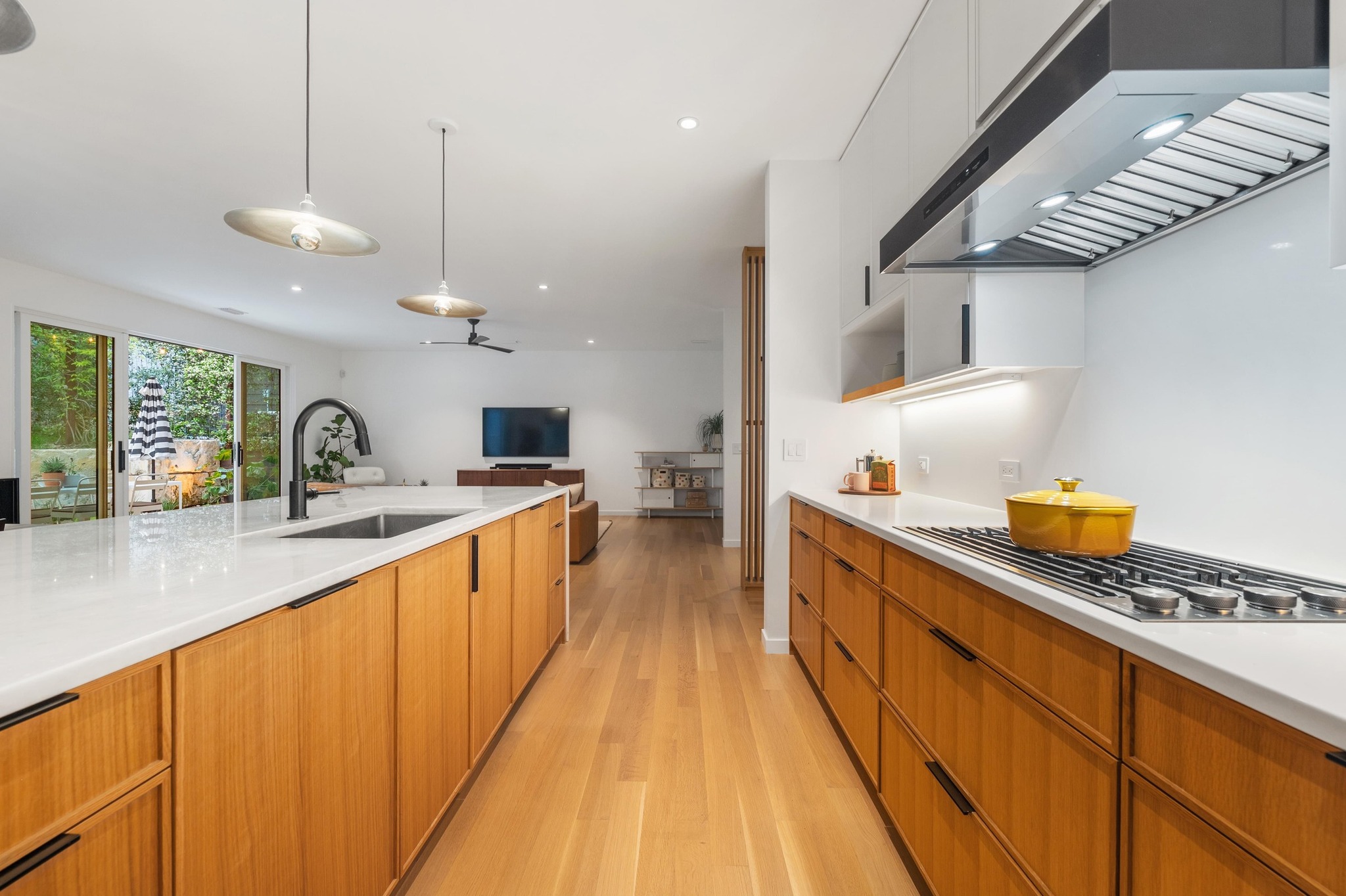 1206 Bickler Road Austin, TX 78704 - Photo 31 of 65 a large kitchen with kitchen island a large island in it