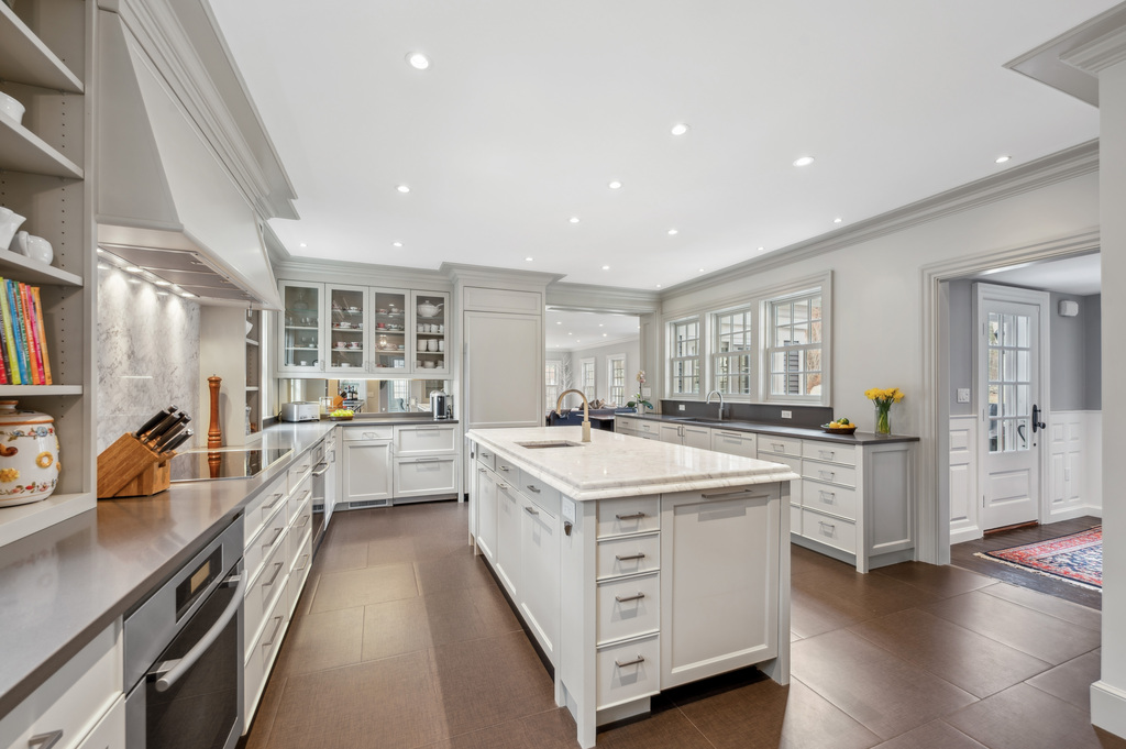 79 Pine Street Dover, MA 02030 - Photo 8 of 25 a kitchen with white cabinets and white appliances