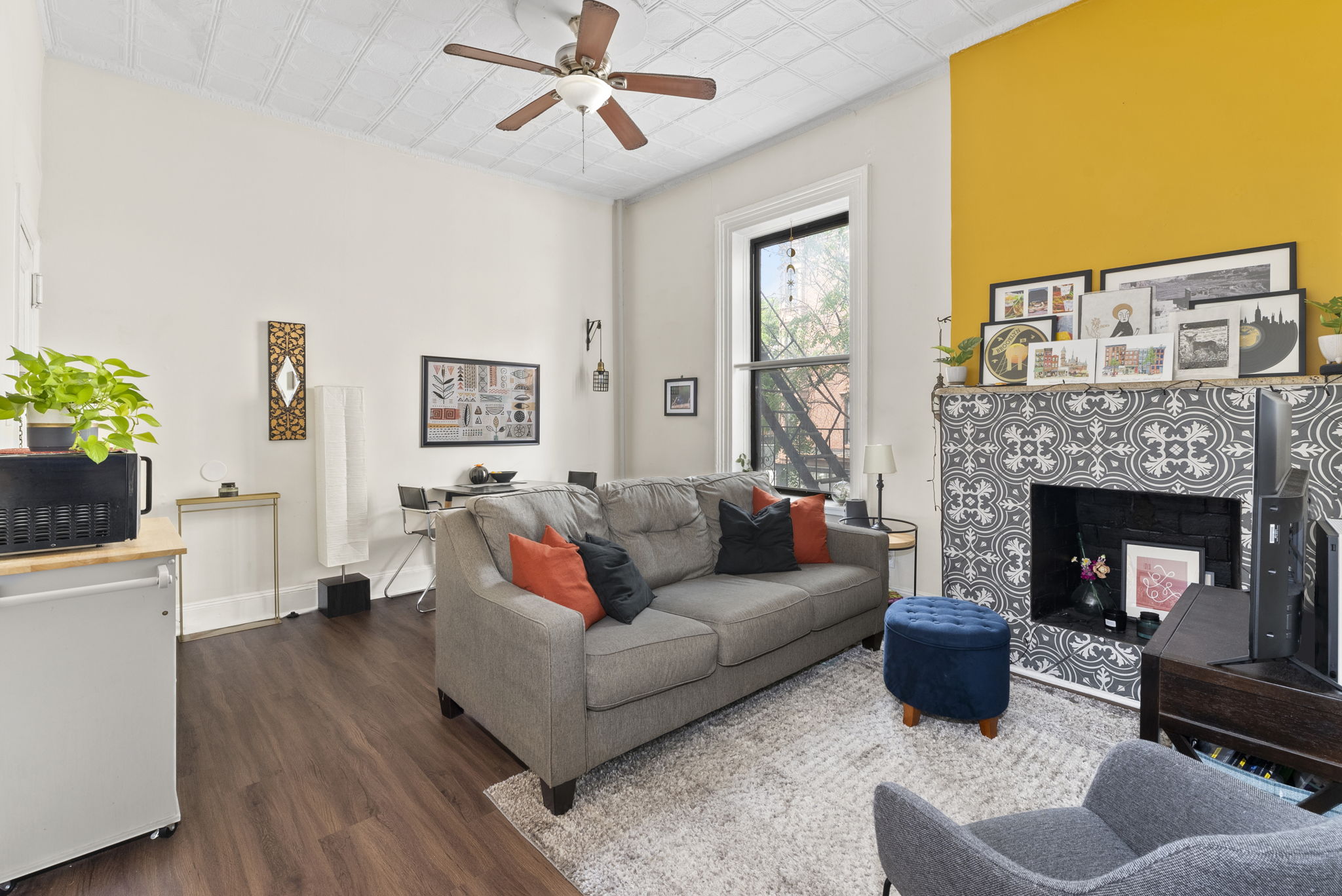 a living room with furniture and a fireplace