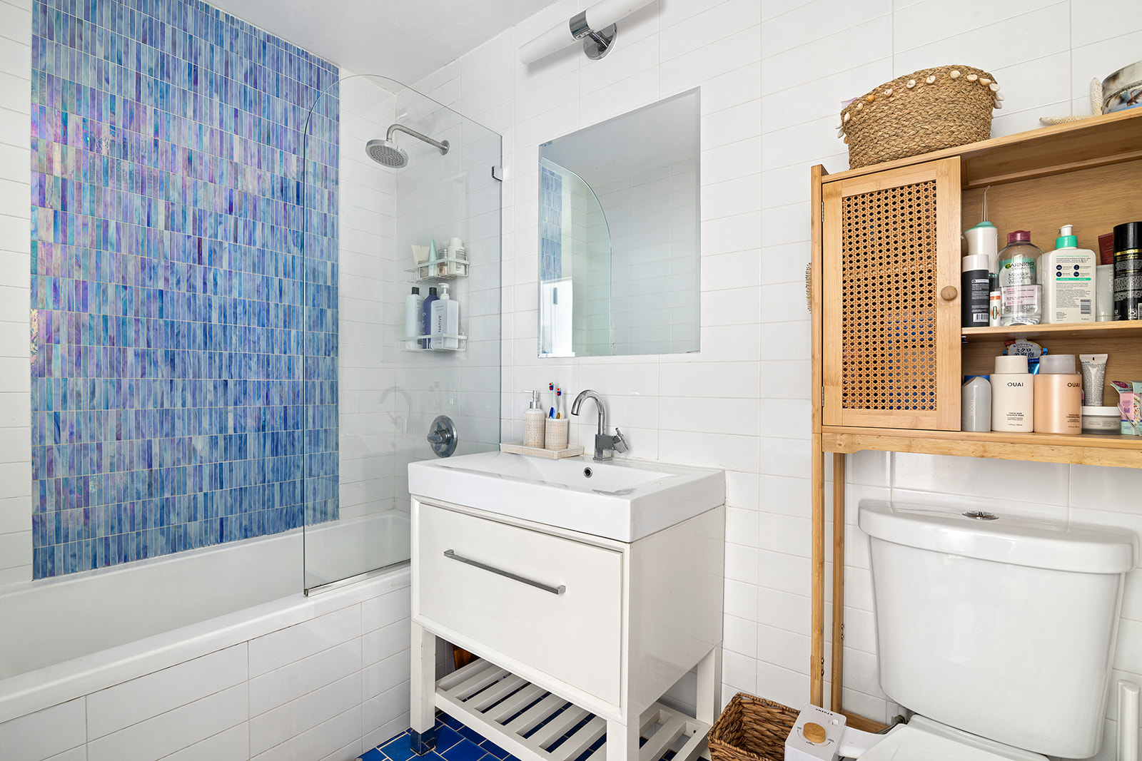 91-16 Shore Front Parkway, Unit 2F Queens, NY 11693 - Photo 6 of 9 a bathroom with a sink toilet and shower