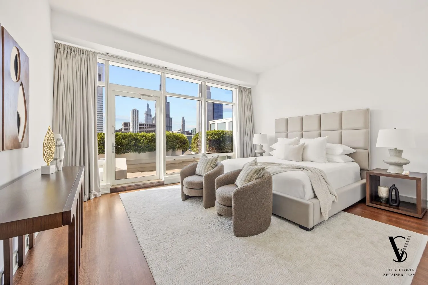 a bedroom with bed and a large window