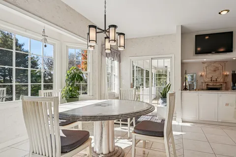 a view of a dining room with furniture window and outside view