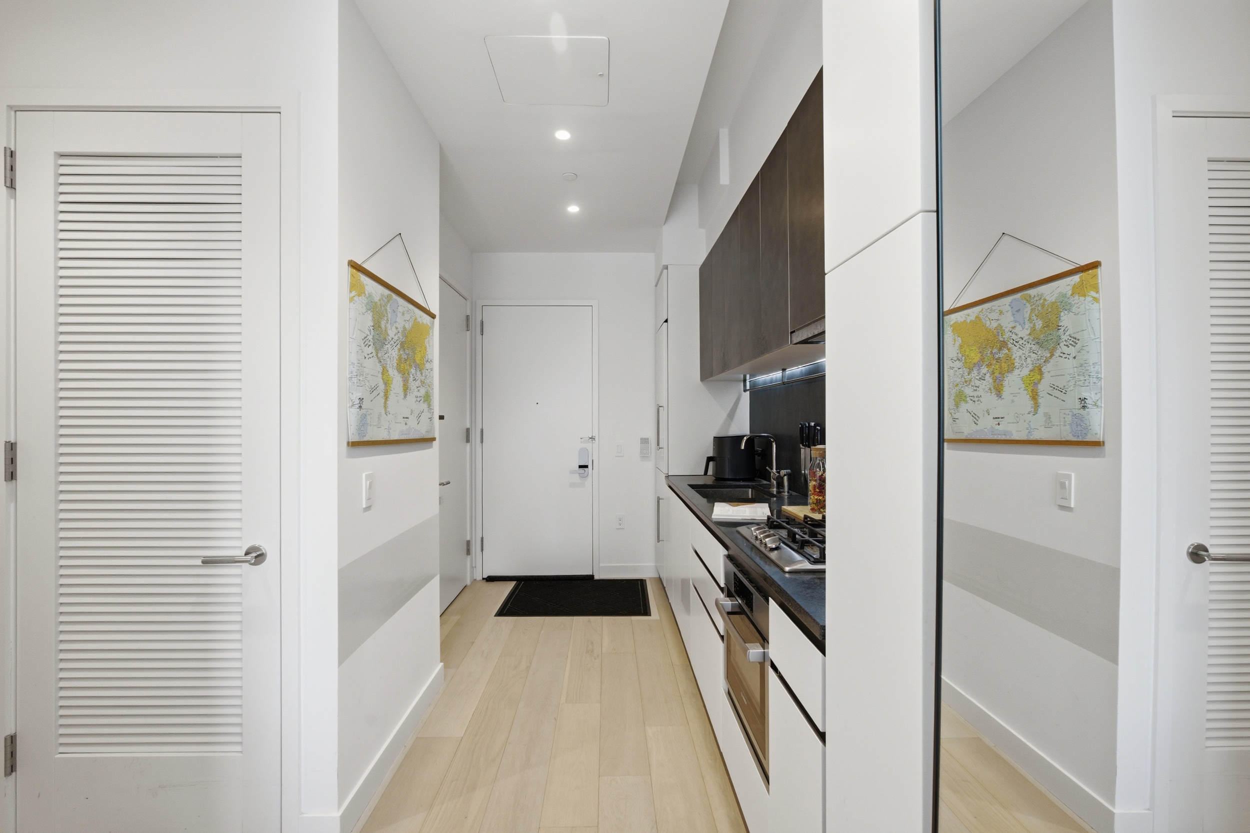 11 Hoyt Street, Unit 14M Brooklyn, NY 11201 - Photo 8 of 22 a kitchen with stainless steel appliances a refrigerator and a stove