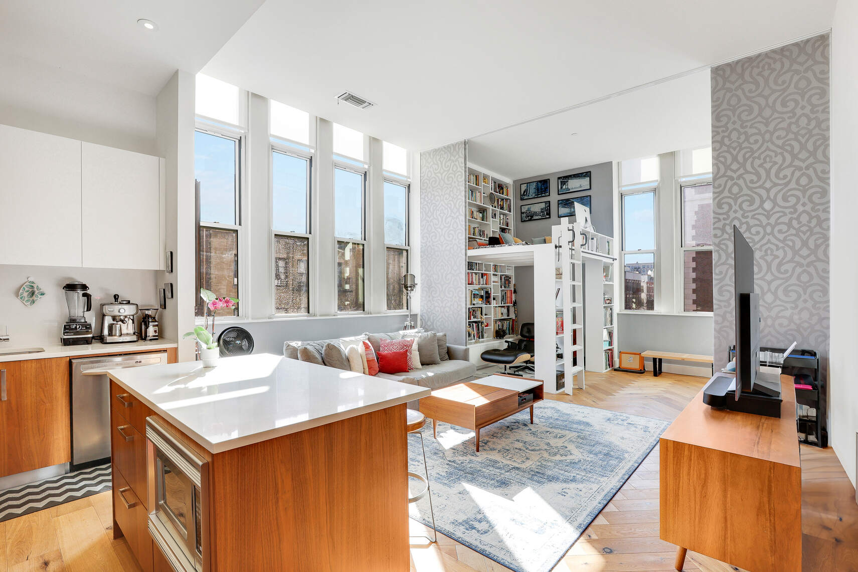 a view of living room with granite countertop furniture and a fireplace