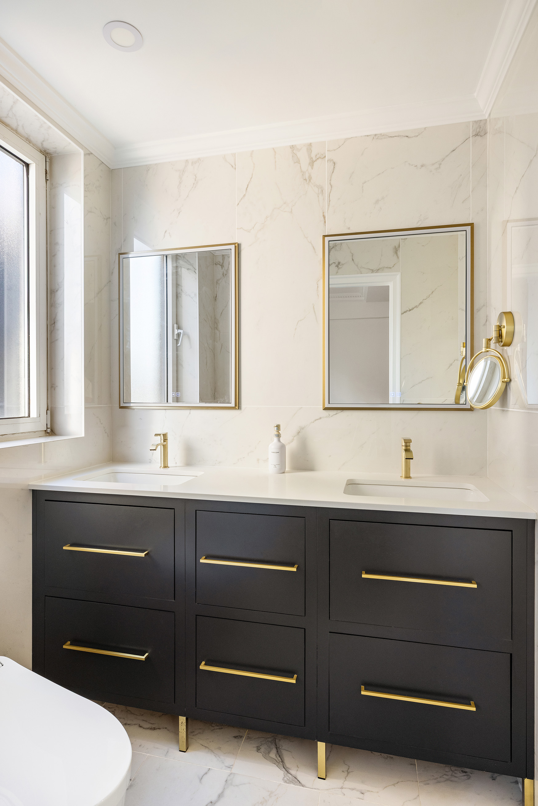 875 5th Avenue, Unit 8D Manhattan, NY 10065 - Photo 8 of 13 a bathroom with a toilet a sink a mirror and