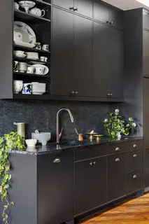 a kitchen with a sink and cabinets