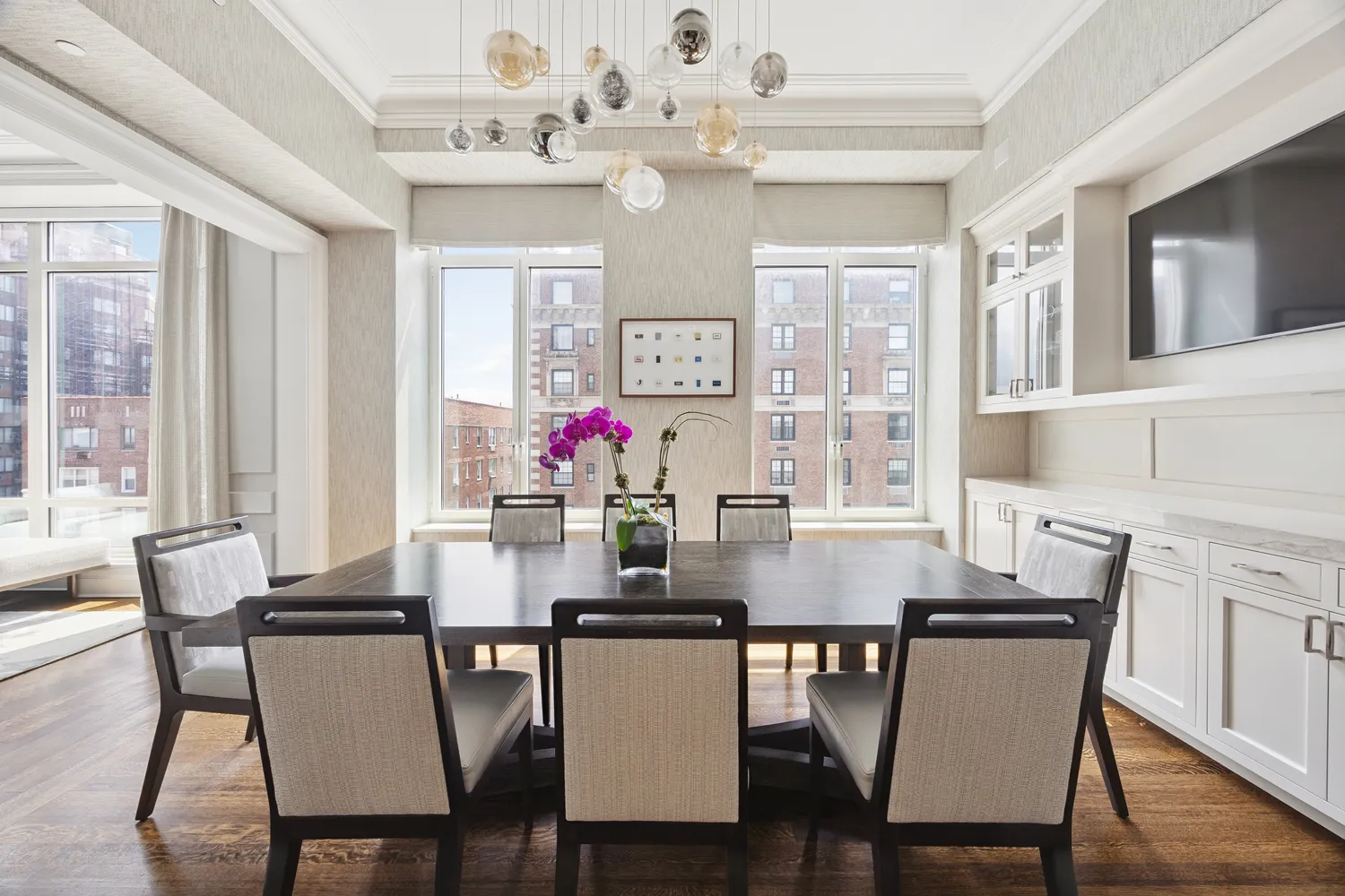 a view of a dining room with furniture and wooden floor
