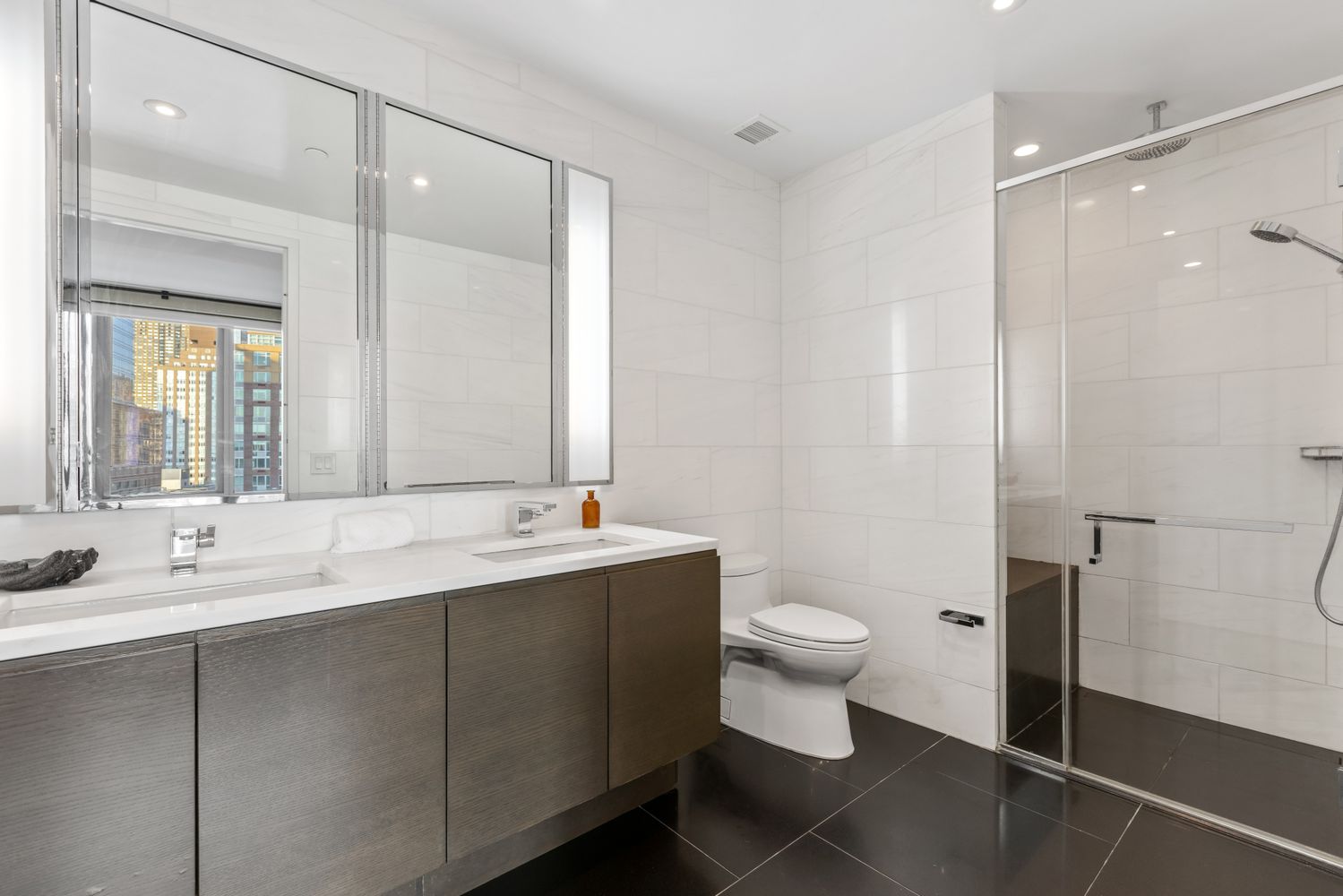 a bathroom with a sink toilet and a mirror