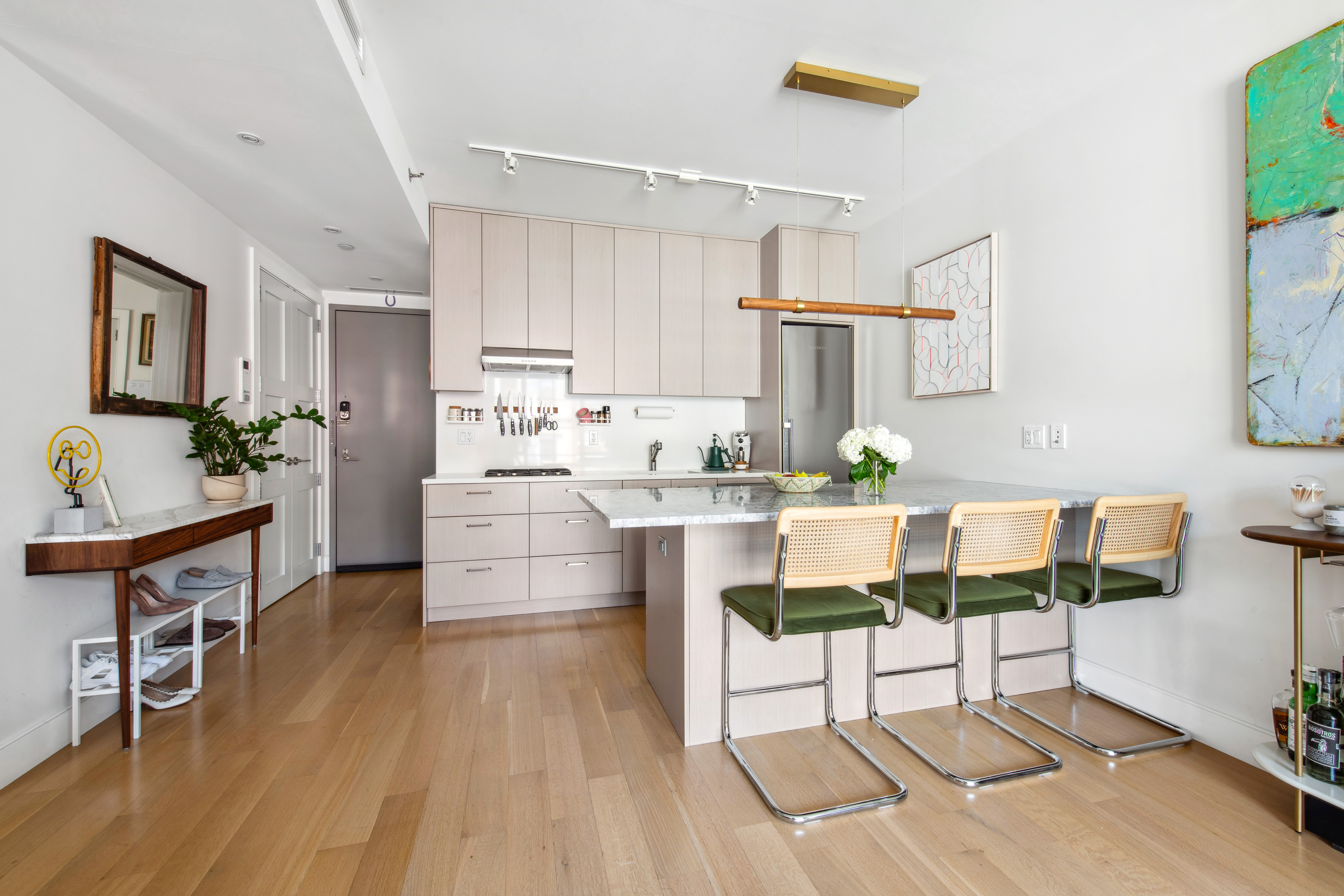 536 East 13th Street, Unit 5F Manhattan, NY 10009 - Photo 6 of 16 a kitchen with stainless steel appliances kitchen island granite countertop a refrigerator and a stove top oven