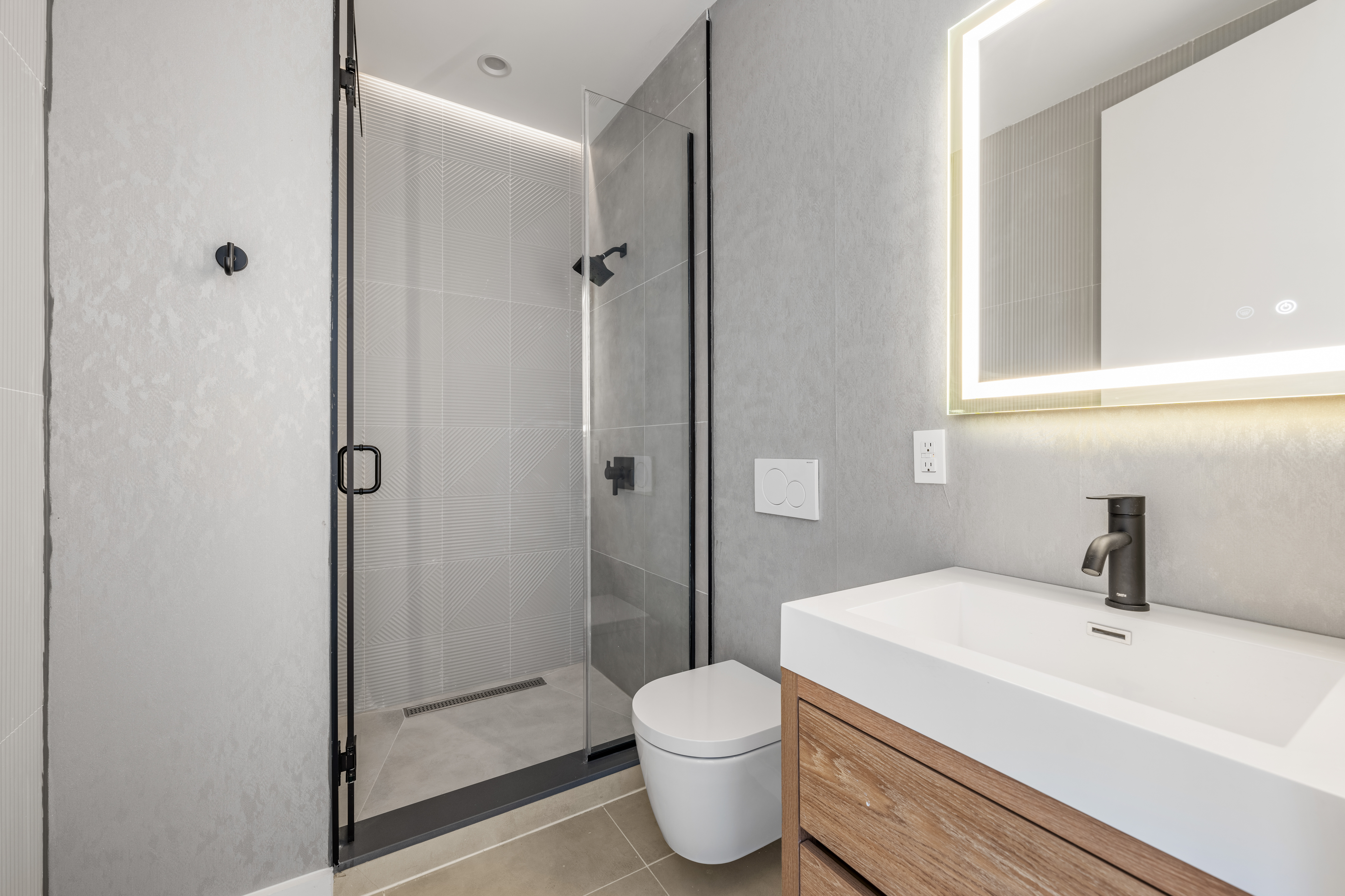 545 Lexington Avenue, Unit 2 Brooklyn, NY 11221 - Photo 12 of 23 a bathroom with a sink toilet and shower