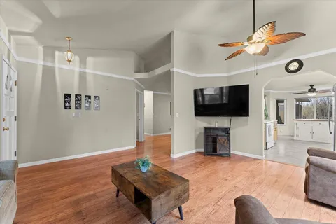 a living room with furniture and a flat screen tv