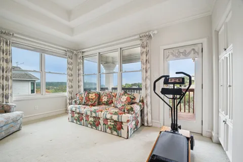 a bedroom with furniture and a window