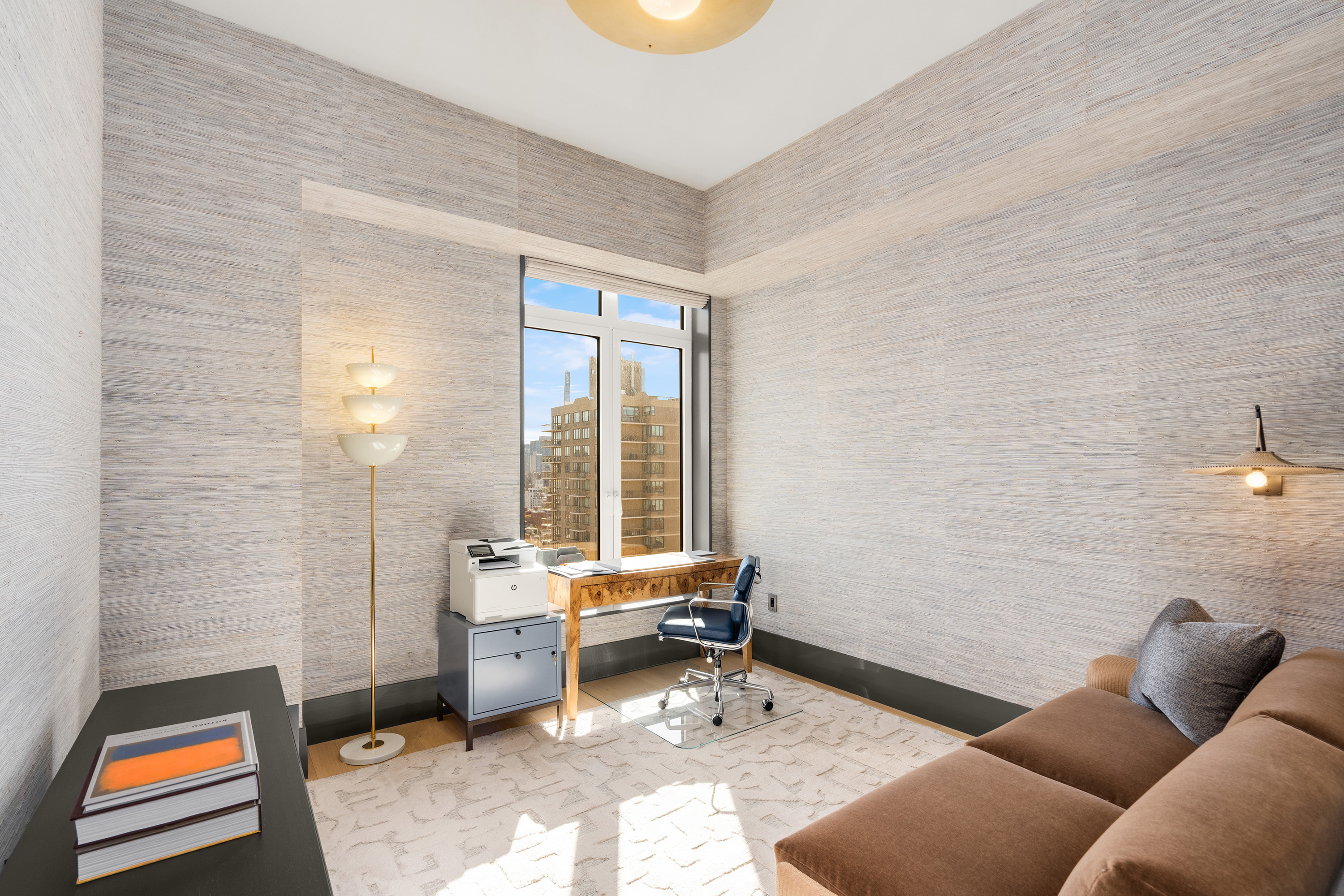 200 East 83rd Street, Unit 24C Manhattan, NY 10028 - Photo 14 of 35 a living room with furniture and a window