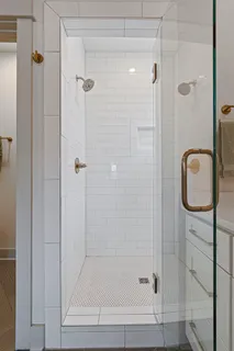 a picture of a bathroom with a shower