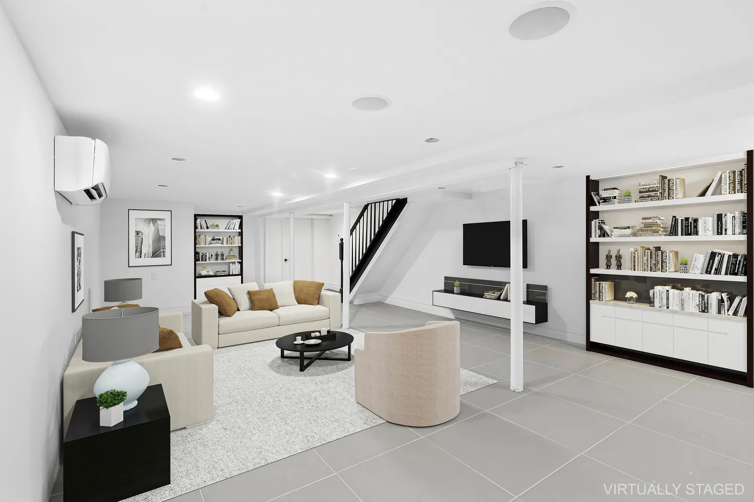 a living room with furniture a flat screen tv and a table