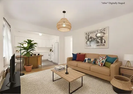 a living room with furniture a chandelier and a window