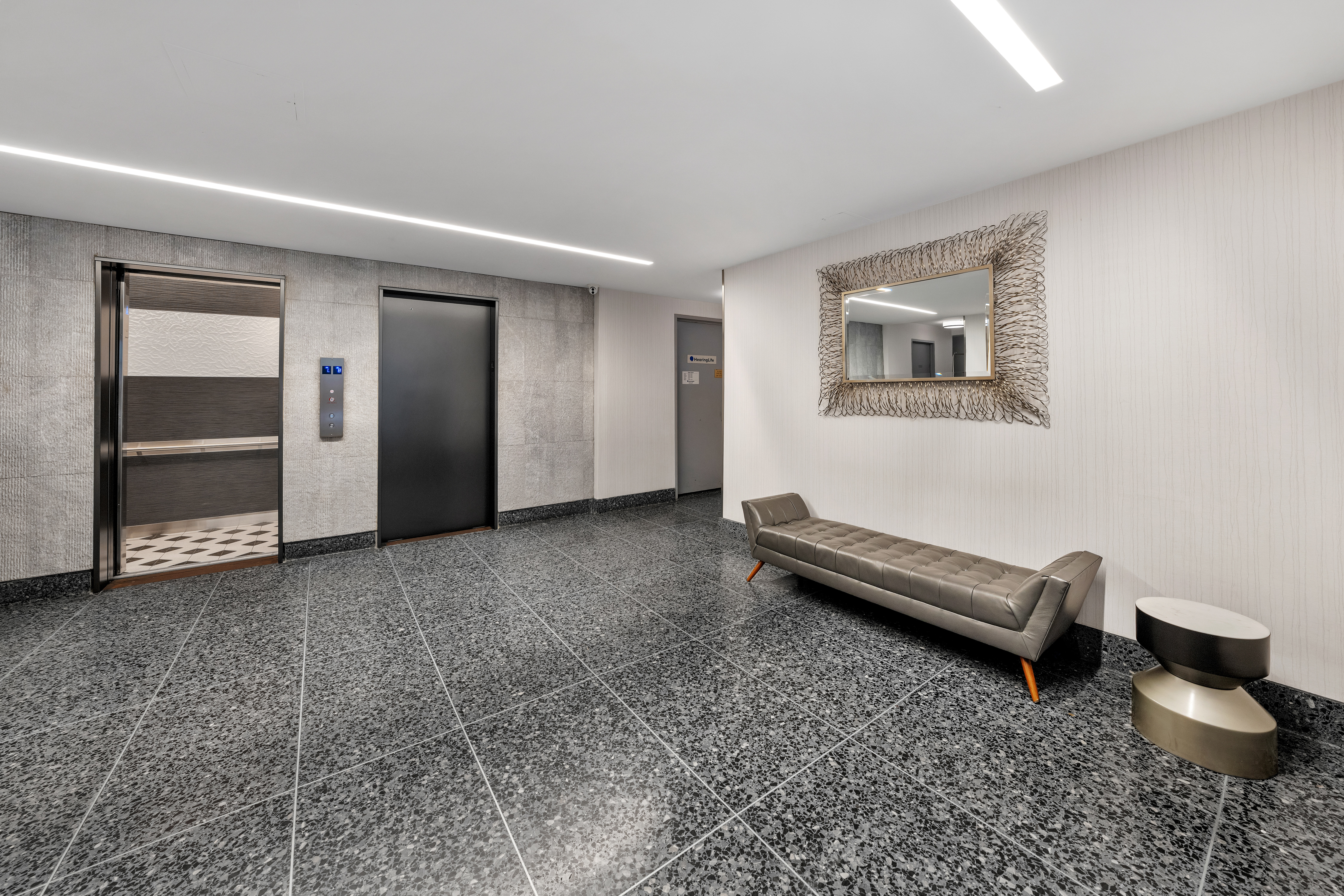 235 East 57th Street, Unit 2D Manhattan, NY 10022 - Photo 5 of 6 a view of a room with furniture and windows