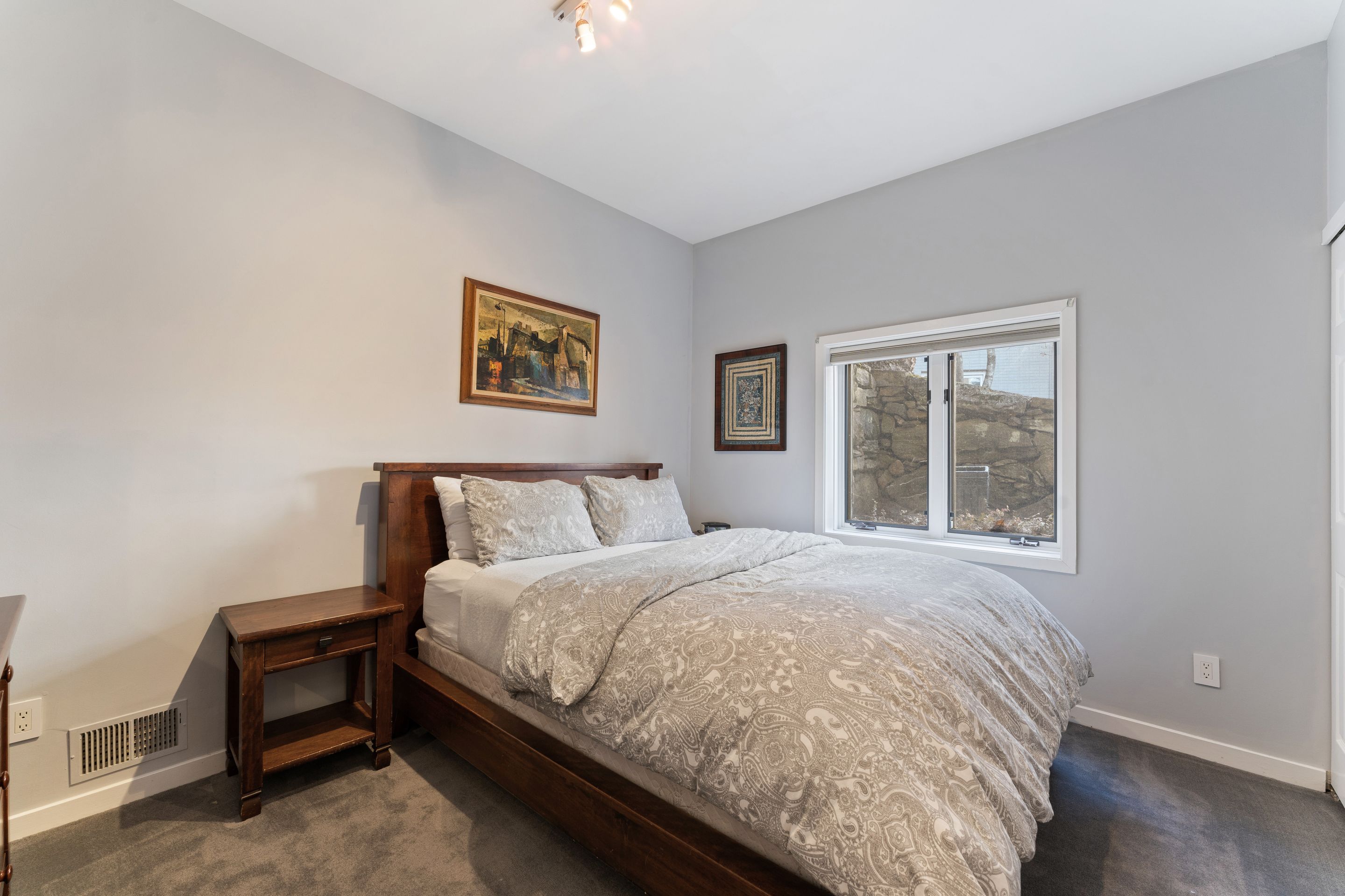 124 Boulder Ridge Road Scarsdale, NY 10583 - Photo 20 of 31 a large bed sitting in a bedroom next to a window