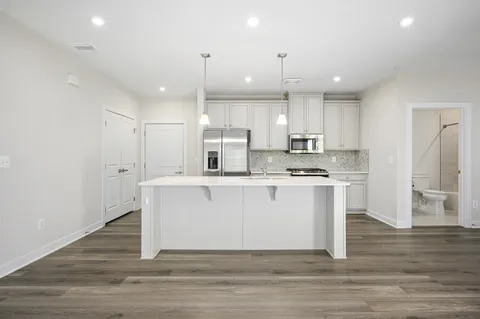 a view of kitchen with wooden floor