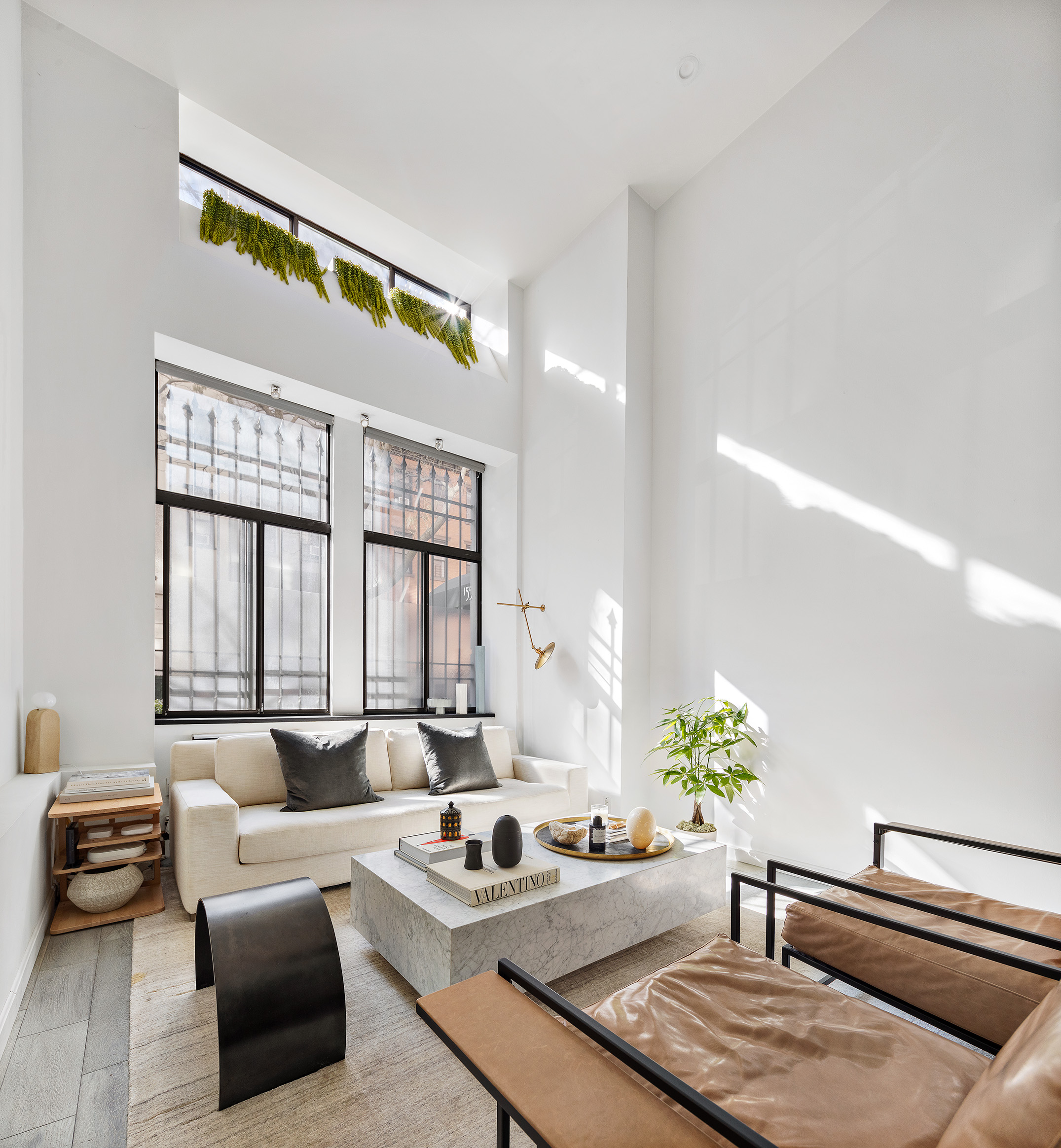 155 West 15th Street, Unit 1J Manhattan, NY 10011 - Photo 1 of 13 a living room with furniture and painting on the wall