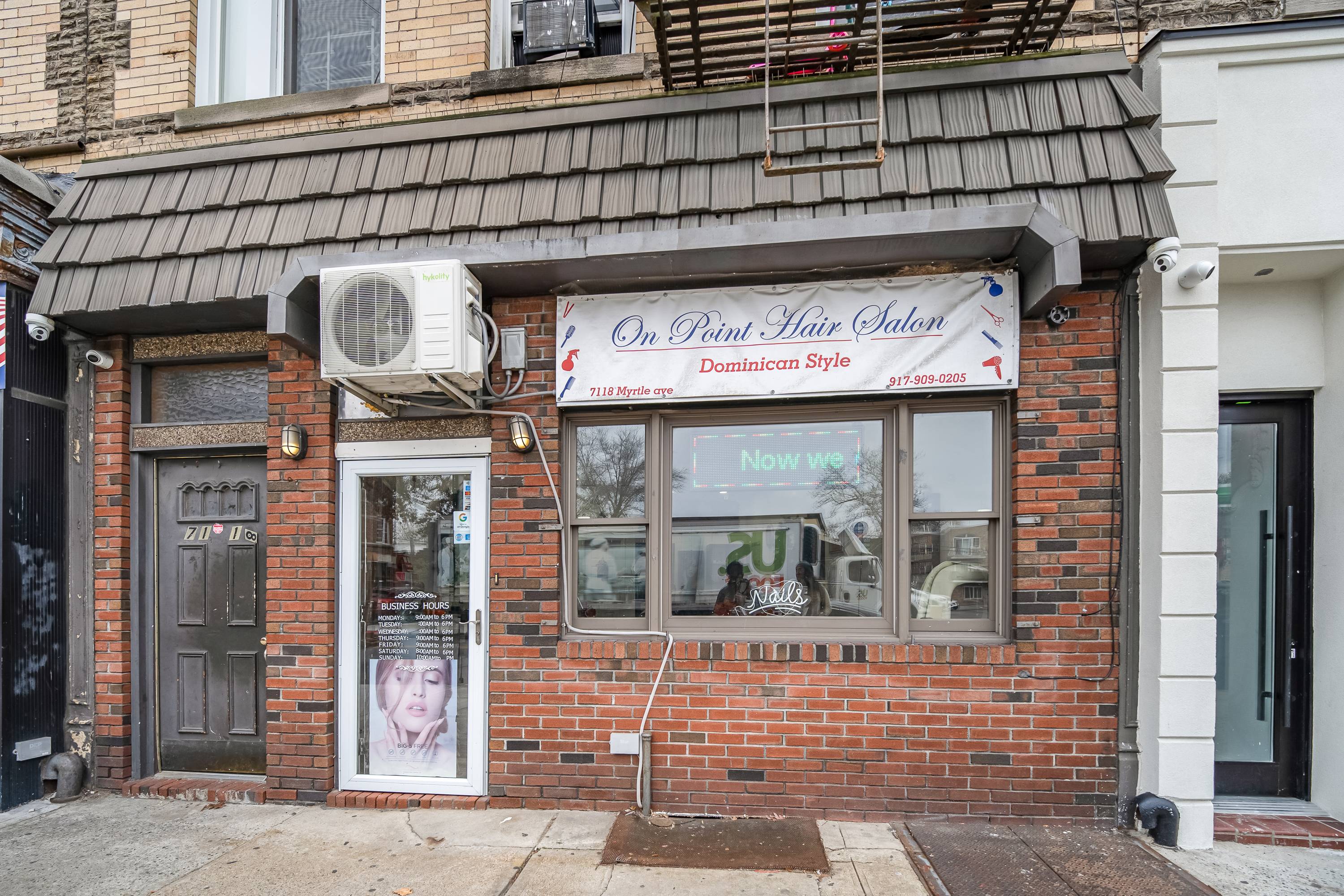 71-18 Myrtle Avenue Queens, NY 11385 - Photo 2 of 13 a view of a brick building with a door