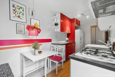 a kitchen with stainless steel appliances granite countertop a stove and a refrigerator