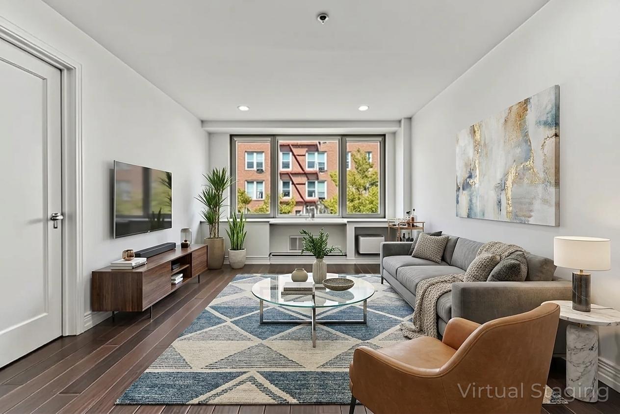 64-05 Yellowstone Boulevard, Unit 414 Queens, NY 11375 - Photo 1 of 14 a living room with furniture and a flat screen tv