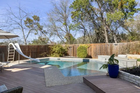 a view of a backyard with sitting area and furniture