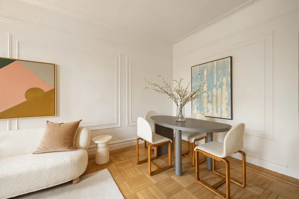 a living room with furniture and a table
