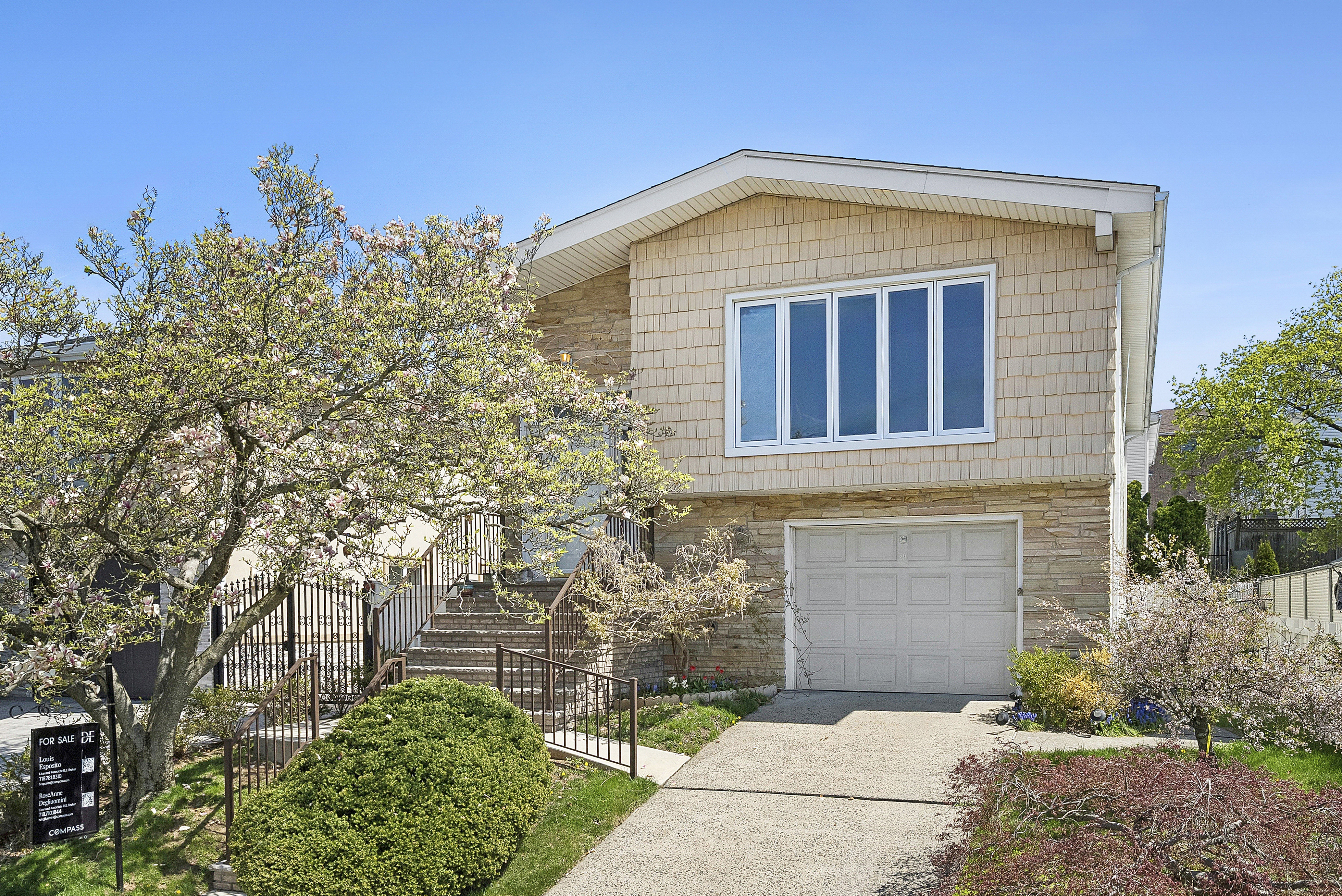 29 Athena Place Staten Island, NY 10314 - Photo 9 of 10 a front view of a house with a garden