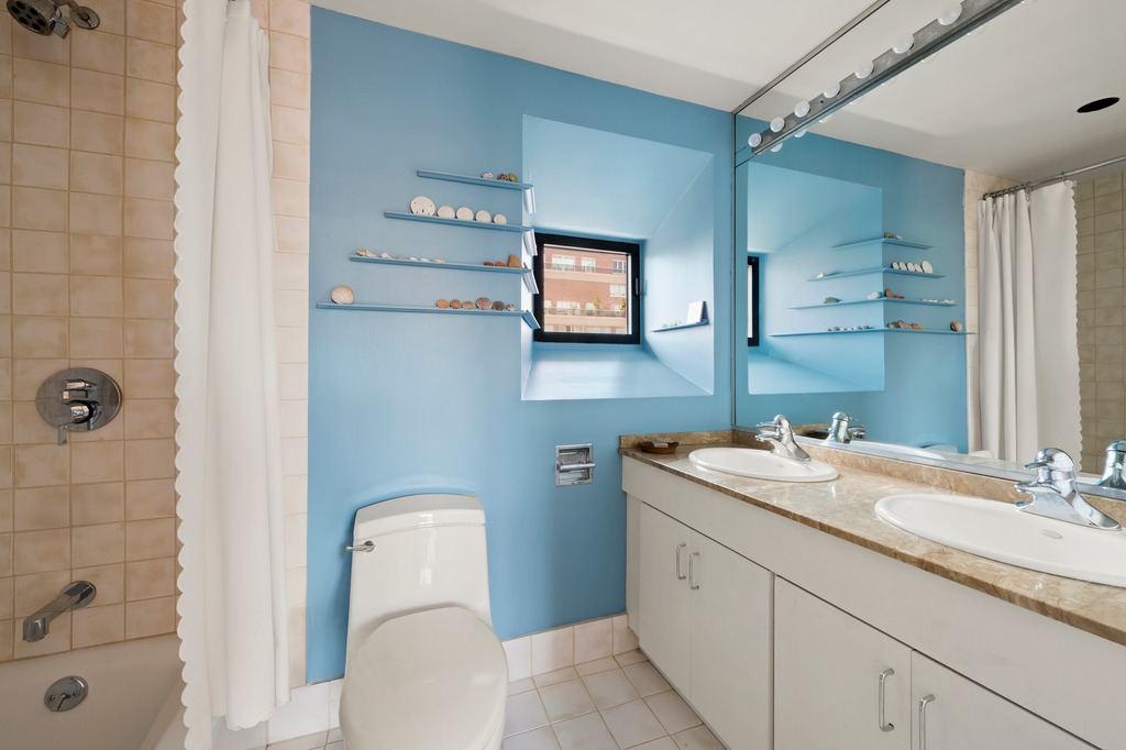 205 West 89th Street, Unit PH6/7 Manhattan, NY 10024 - Photo 11 of 20 a bathroom with a toilet sink and mirror