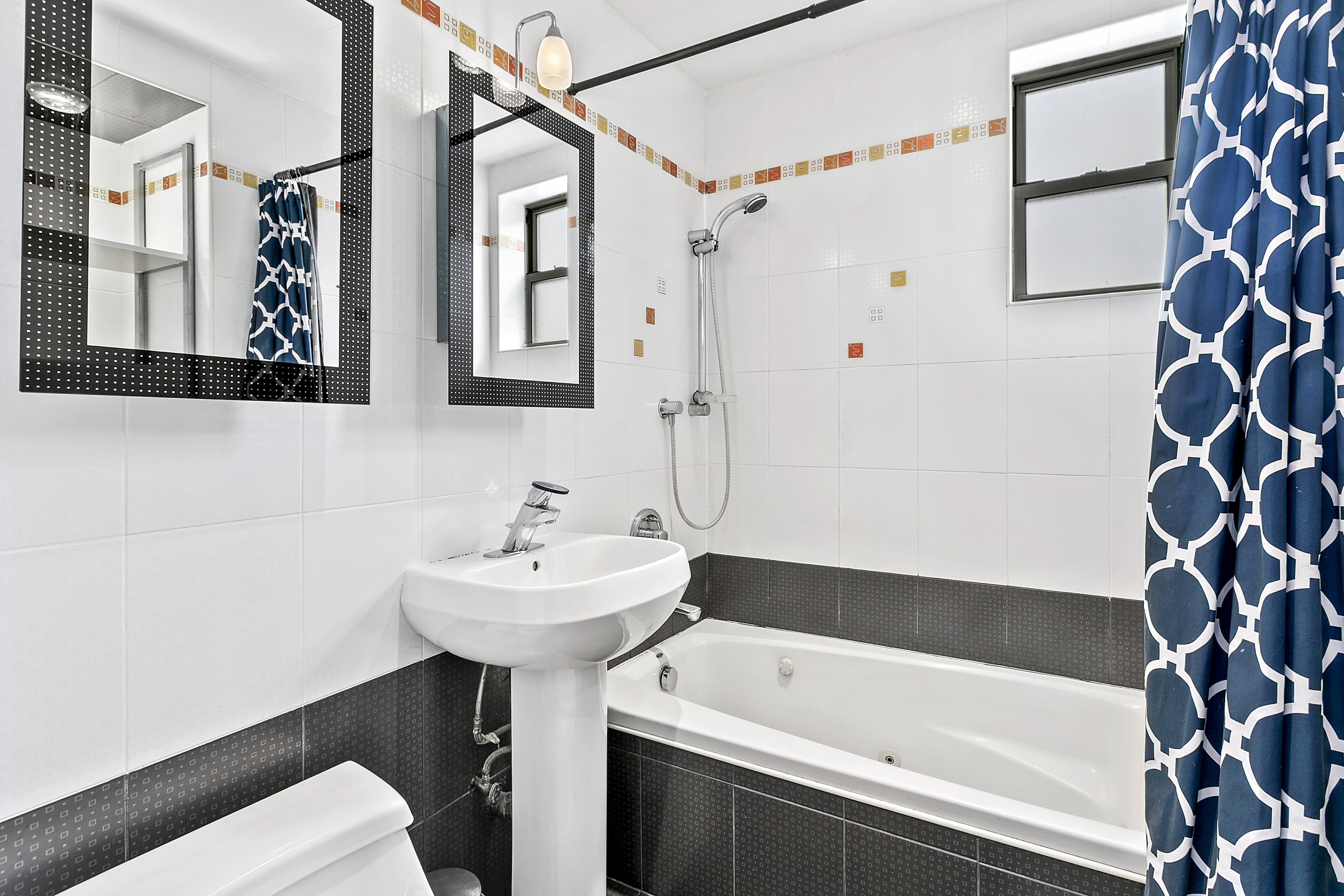 9602 4th Avenue, Unit 6D Brooklyn, NY 11209 - Photo 6 of 7 a bathroom with a sink and a bathtub
