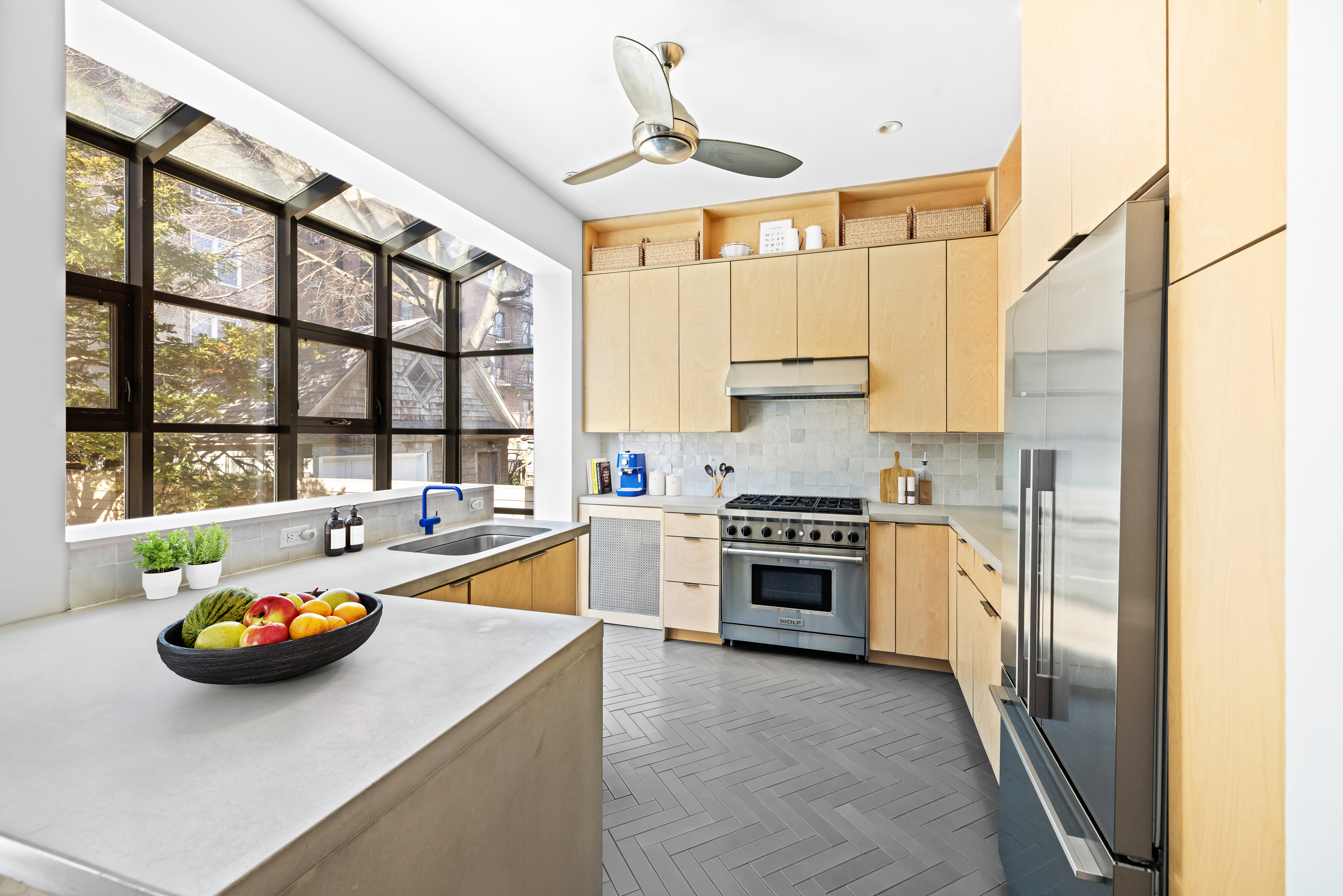 792 East 21st Street Brooklyn, NY 11210 - Photo 2 of 29 a kitchen with a sink appliances and cabinets
