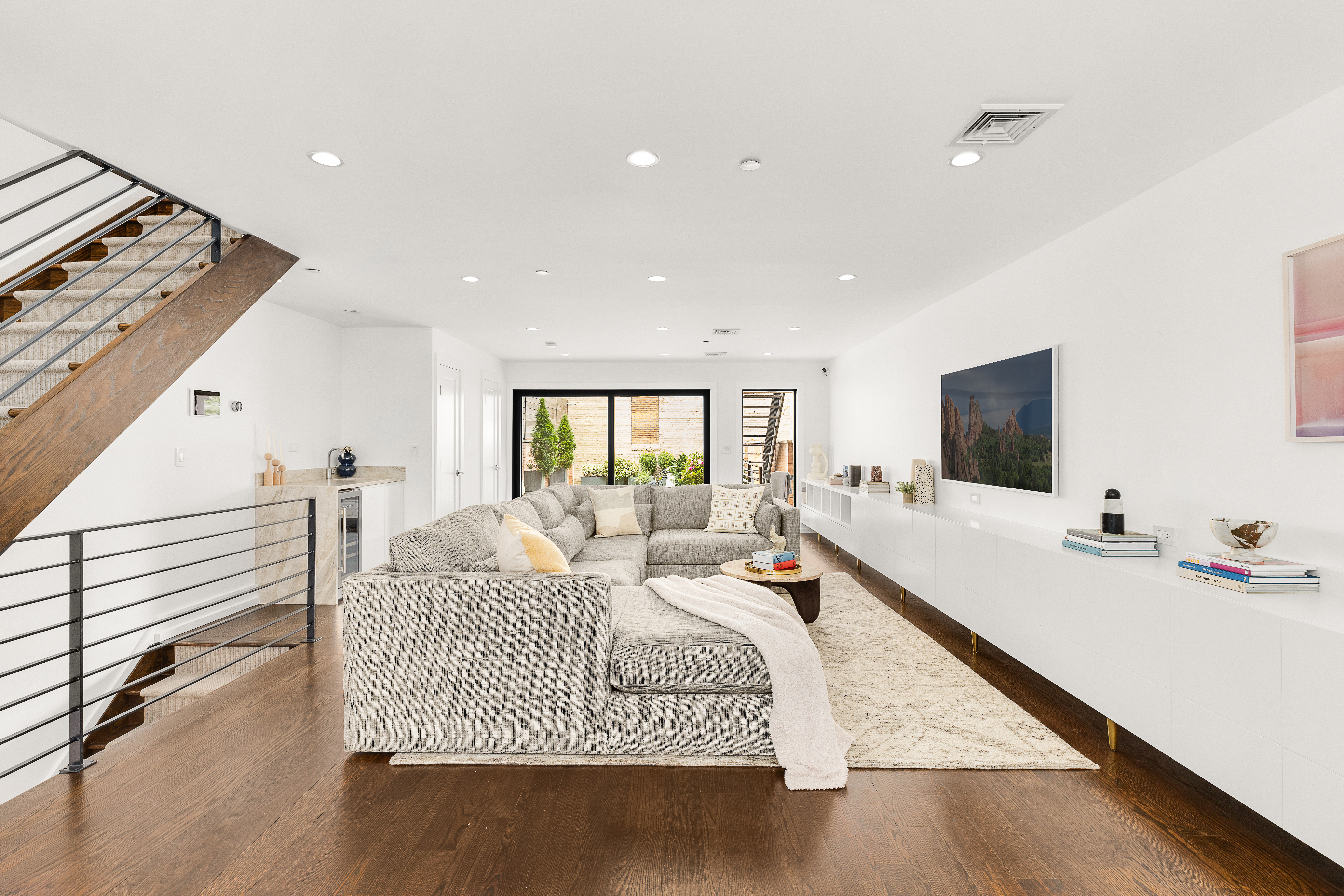 330 Bond Street Brooklyn, NY 11231 - Photo 5 of 18 a living room with furniture and a flat screen tv
