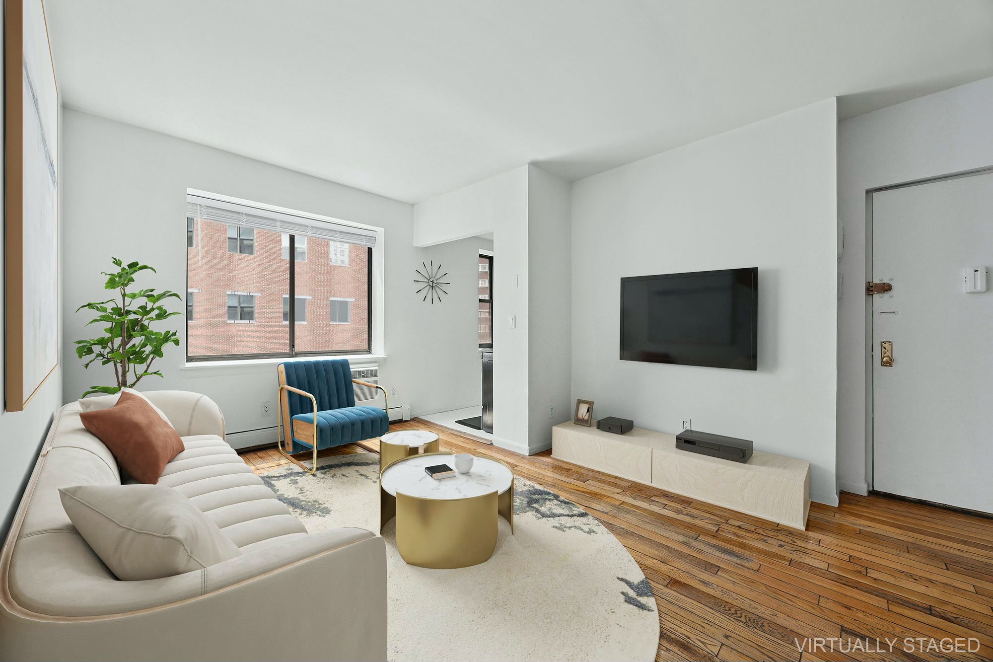61 Lexington Avenue, Unit 4F Manhattan, NY 10010 - Photo 3 of 6 a living room with furniture and a flat screen tv