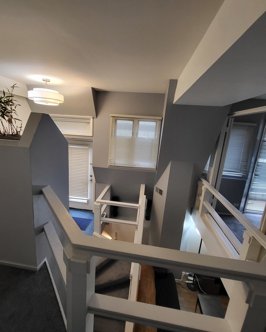 6337 Roosevelt Road, Unit 105 Berwyn, IL 60402 - Photo 15 of 21 a view of an empty room with wooden floor