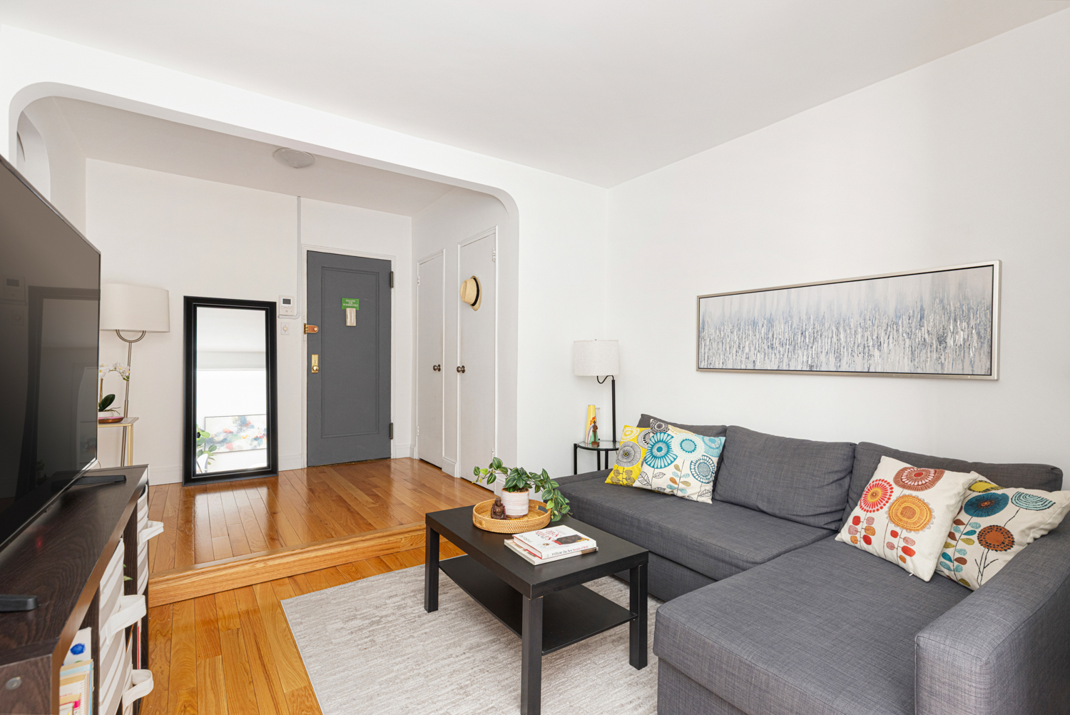 160 West 85th Street, Unit 3F Manhattan, NY 10024 - Photo 3 of 10 a living room with furniture and a flat screen tv