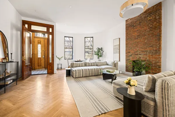 a bedroom with furniture and large windows