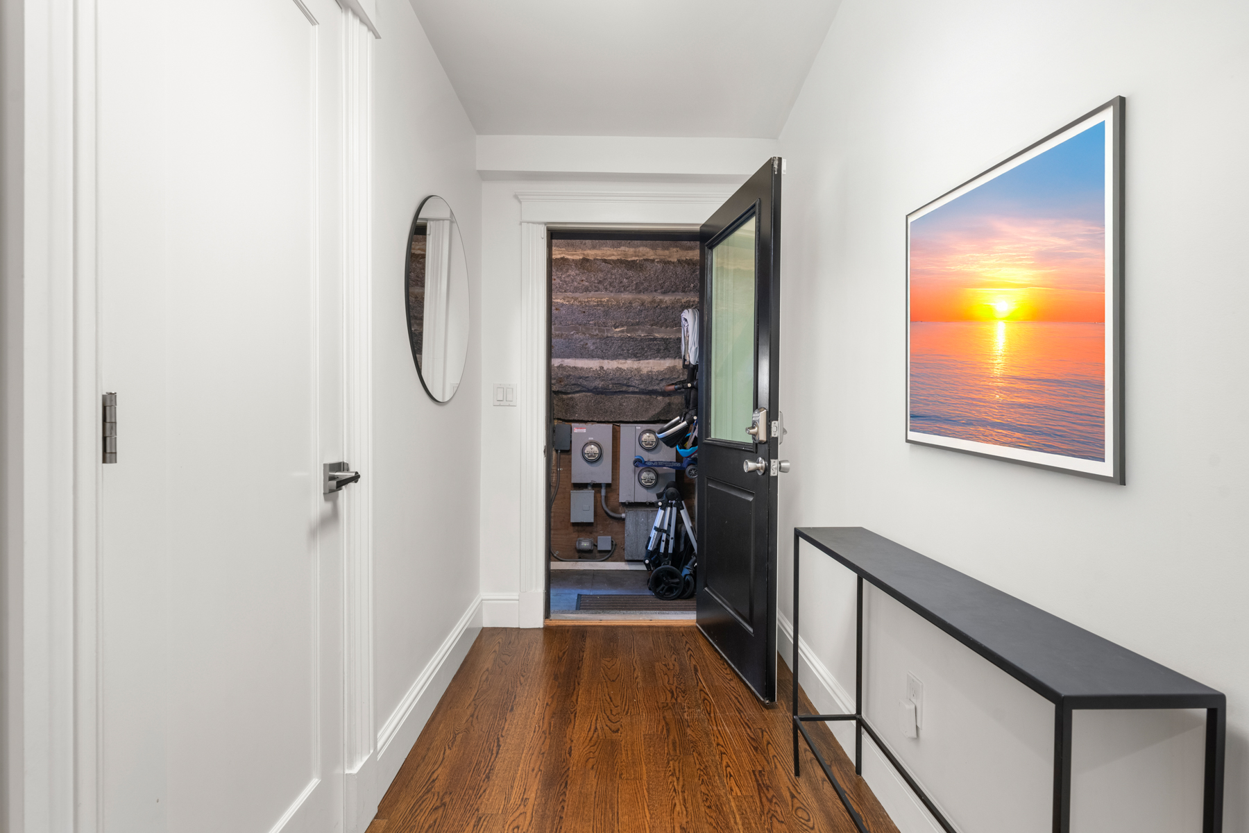 34 Dwight Street, Unit 1 Boston, MA 02118 - Photo 24 of 33 a view of a hallway with wooden floor and a living room