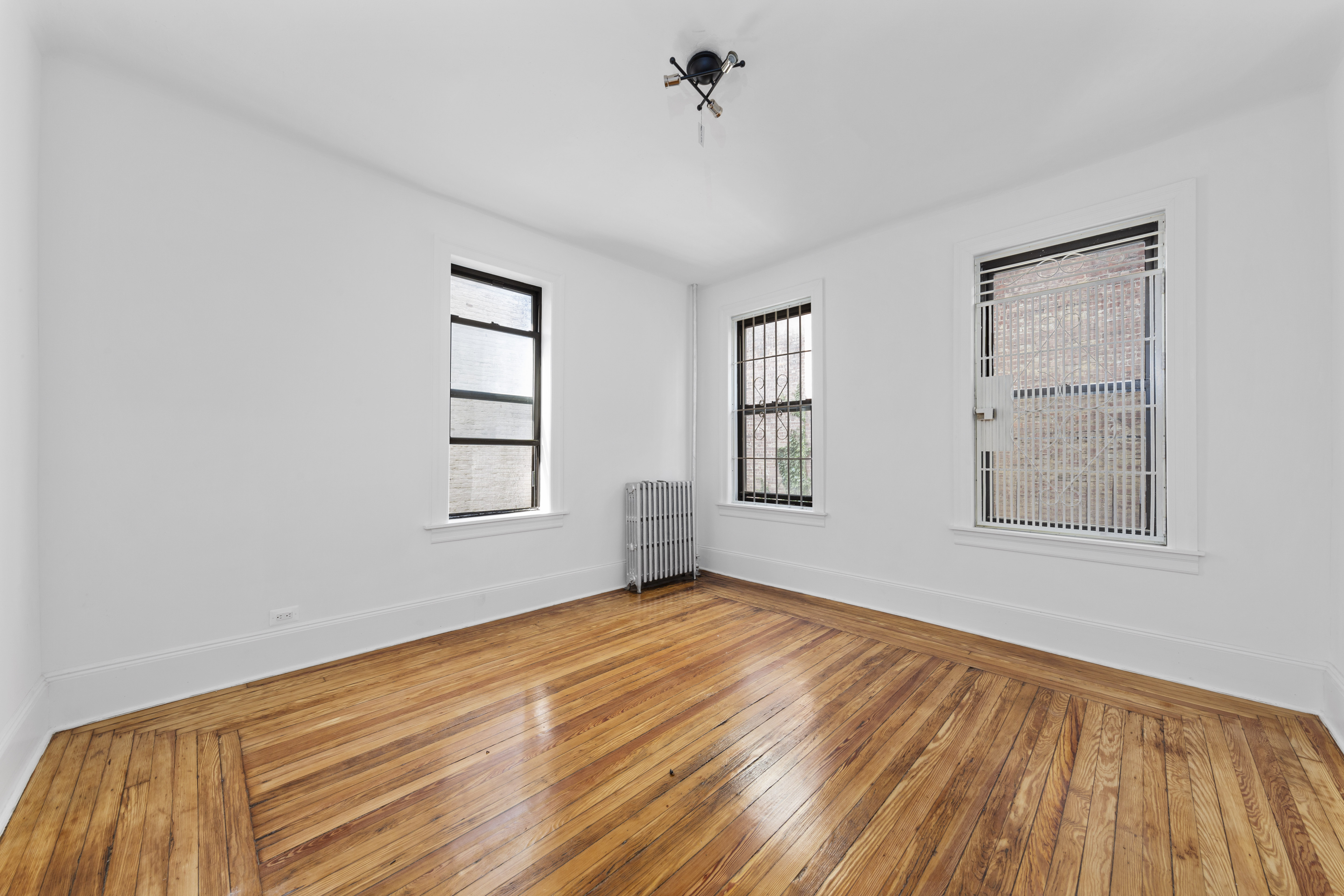 172 Prospect Park West, Unit 3L Brooklyn, NY 11215 - Photo 9 of 10 a view of empty room with wooden floor and fan