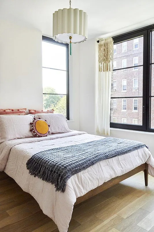 264 Webster Avenue, Unit 303 Brooklyn, NY 11230 - Photo 4 of 11 a bedroom with a bed and window
