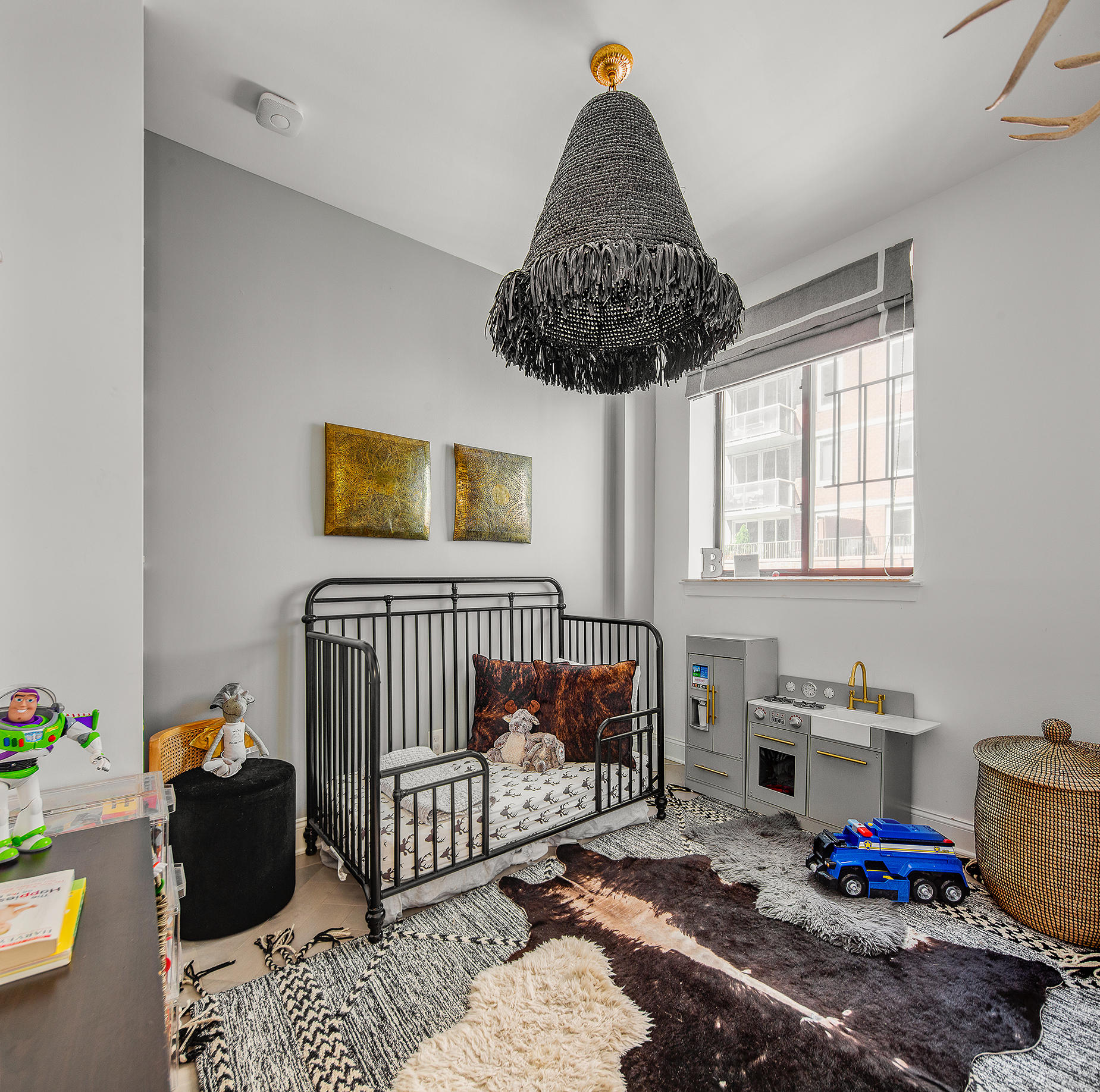 529 West 42nd Street, Unit 9R Manhattan, NY 10036 - Photo 7 of 10 a bedroom with a bed and a chandelier