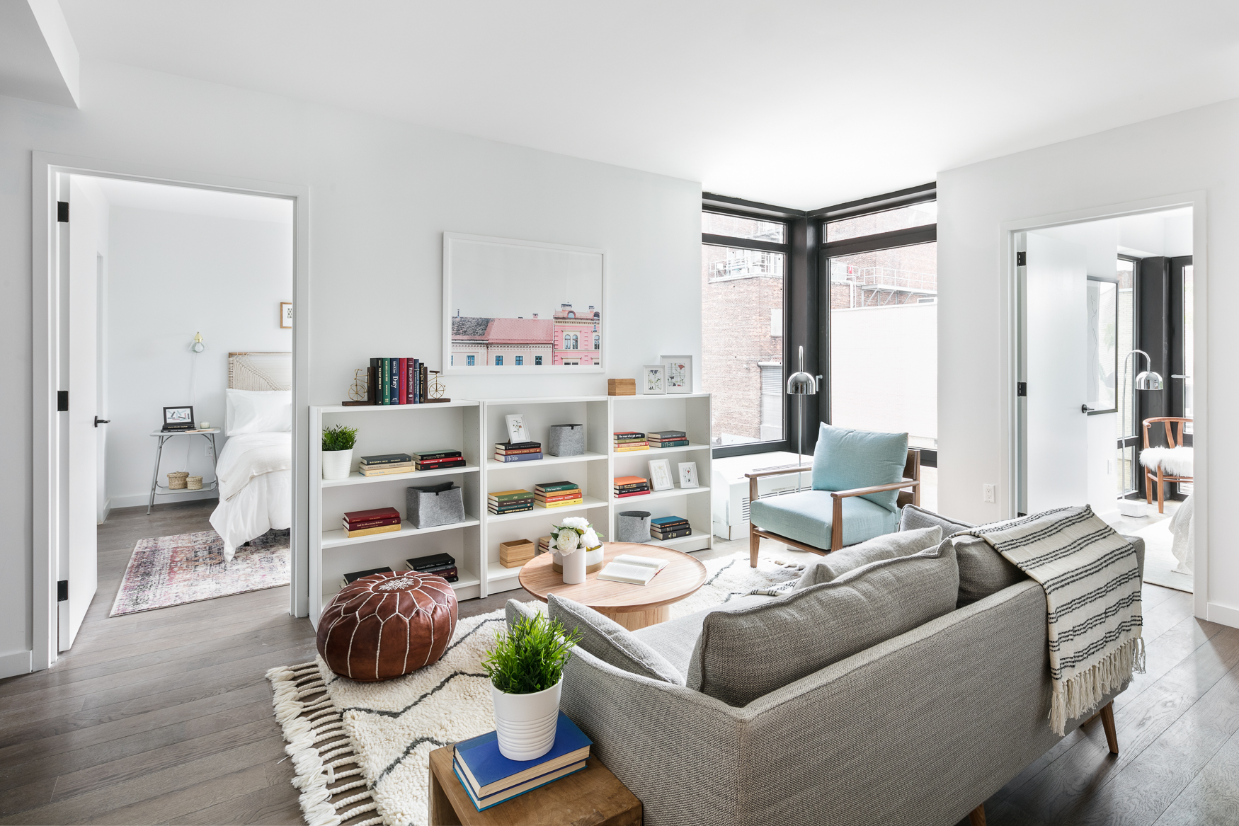16-26 Madison Street, Unit 4I Queens, NY 11385 - Photo 3 of 18 a living room with furniture and a book shelf